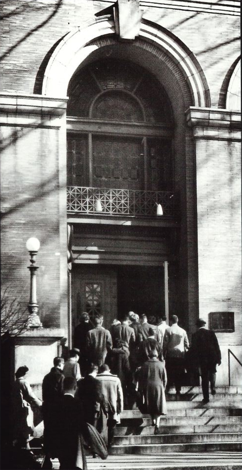 black and white photo of Old Main Chapel entrance with students entering by Penn State Archives