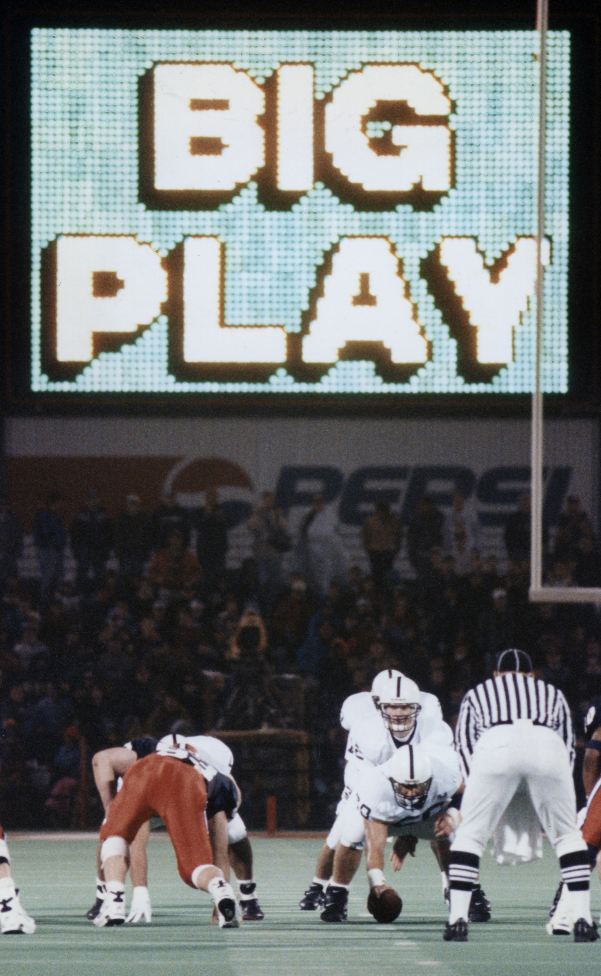 Lions driving under Big Play on the big screen, photo by Steve Manuel '84 Lib, '92 MA Com