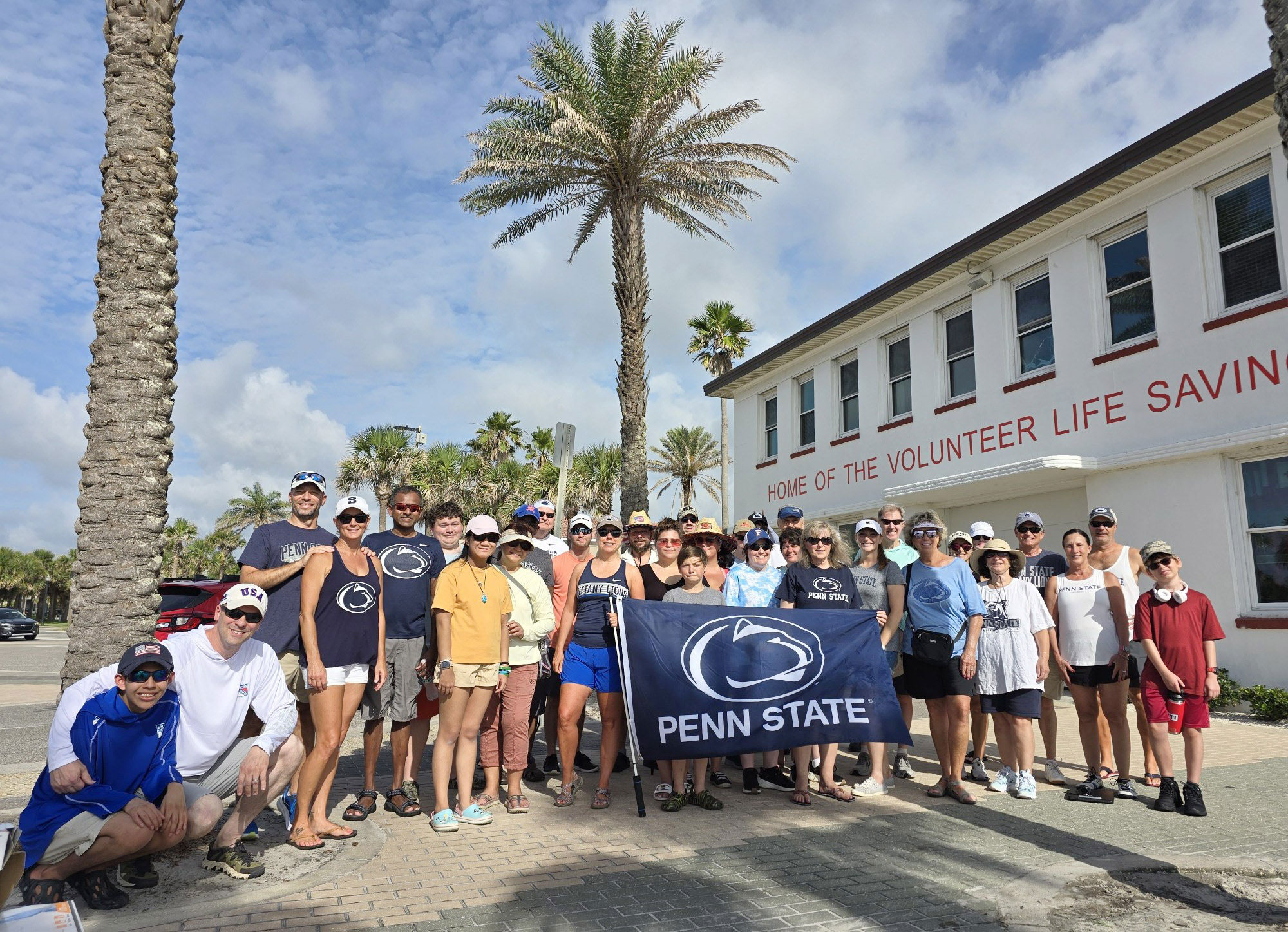 group photo of Jacksonville chapter holding a Penn State flag, courtesy