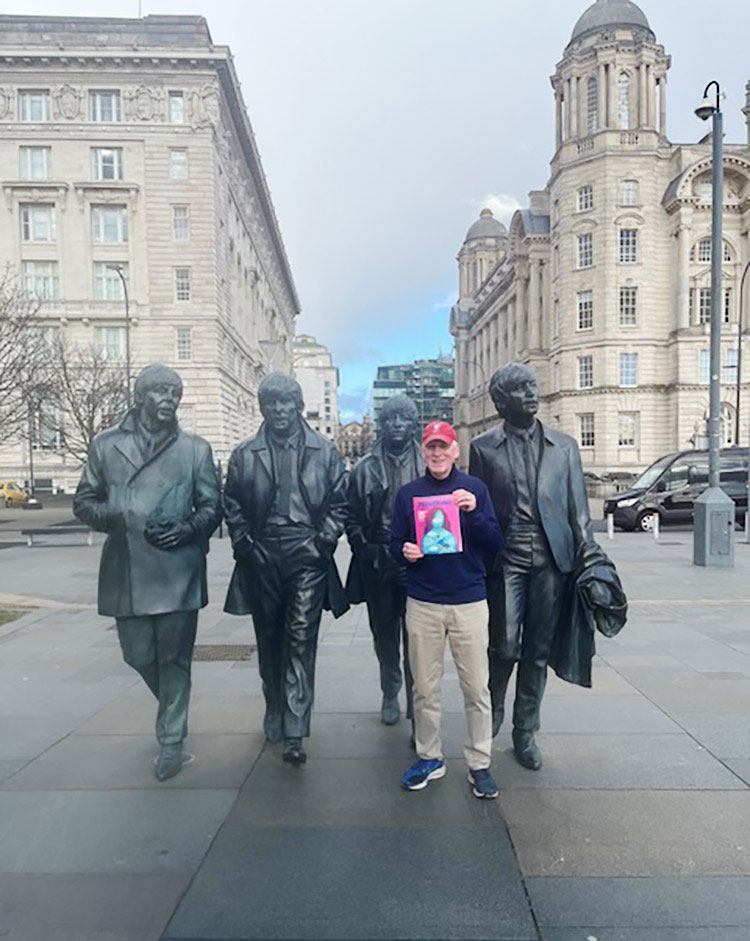 photo of an alum holding the March/April '25 issue of Penn Stater magazine in front of the Beatles statue in London, courtesy