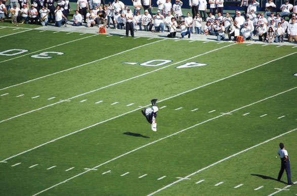 photograph football player doing backflip