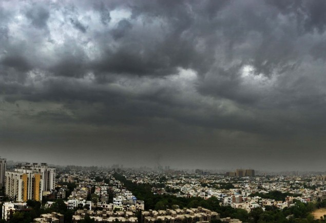 spread of an aerial shot of New Delhi under dark cloud cover, Photo by Parveen Kumar/Hindustan Times, via Getty Images