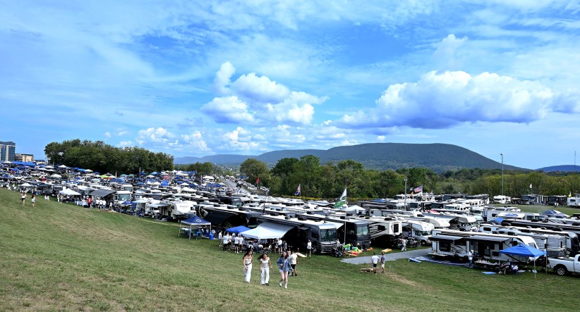 wide shot of tailgaters against backdrop of Mount Nittany by Penn State Alumni Association