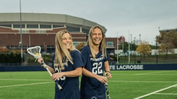 Kara and Regan Nealon on Penn State lacrosse field, photo by Cardoni