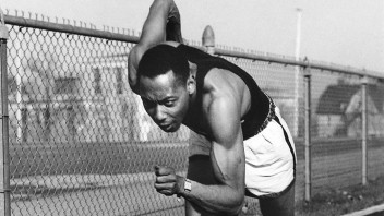 Black and white photo of Barney Ewell running on track by Penn State Archives