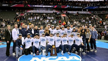 photo of NCAA wrestling team with trophy after their 12th championship by Mark Selders/Penn State Athletics