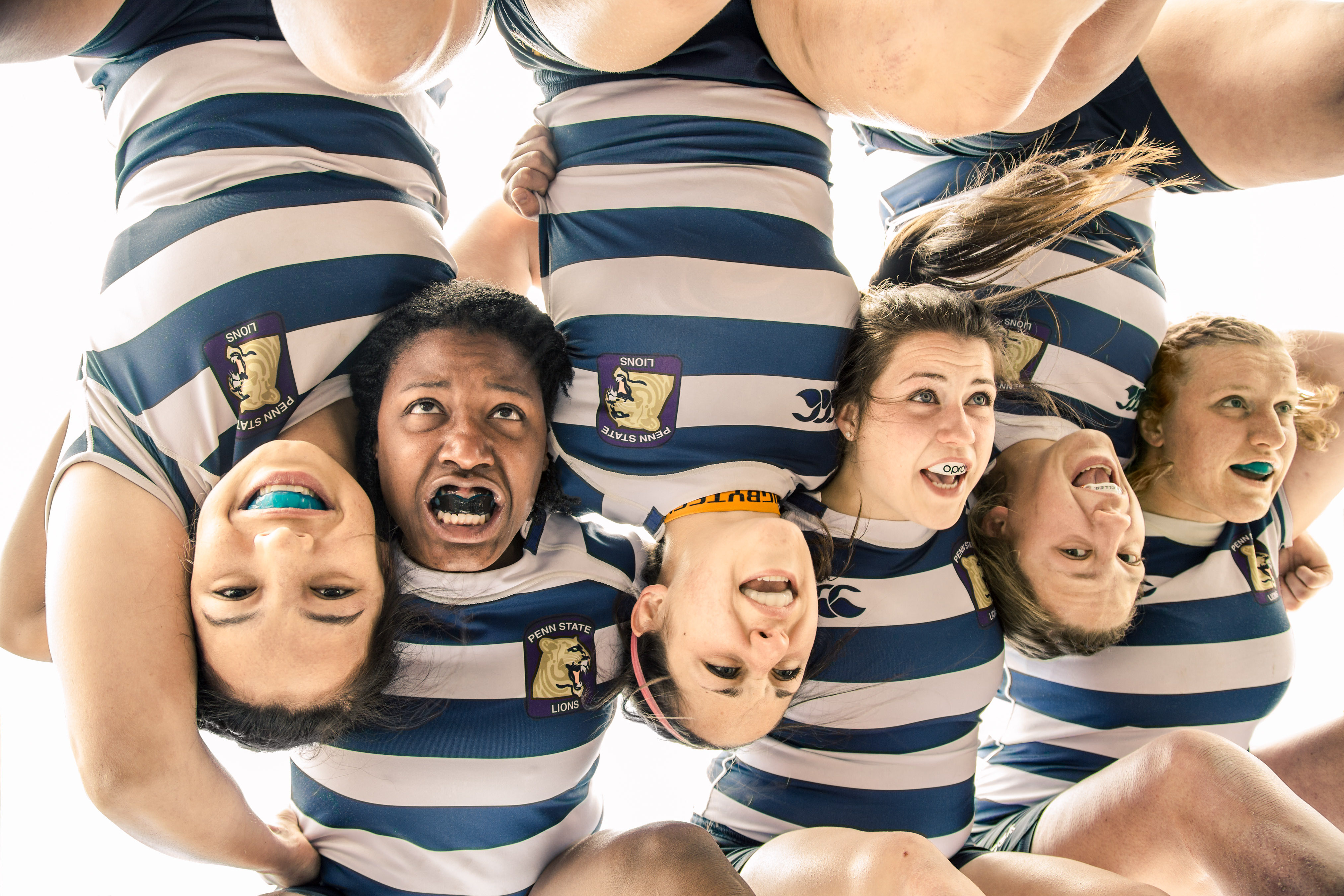 PSU women's rugby players in huddle