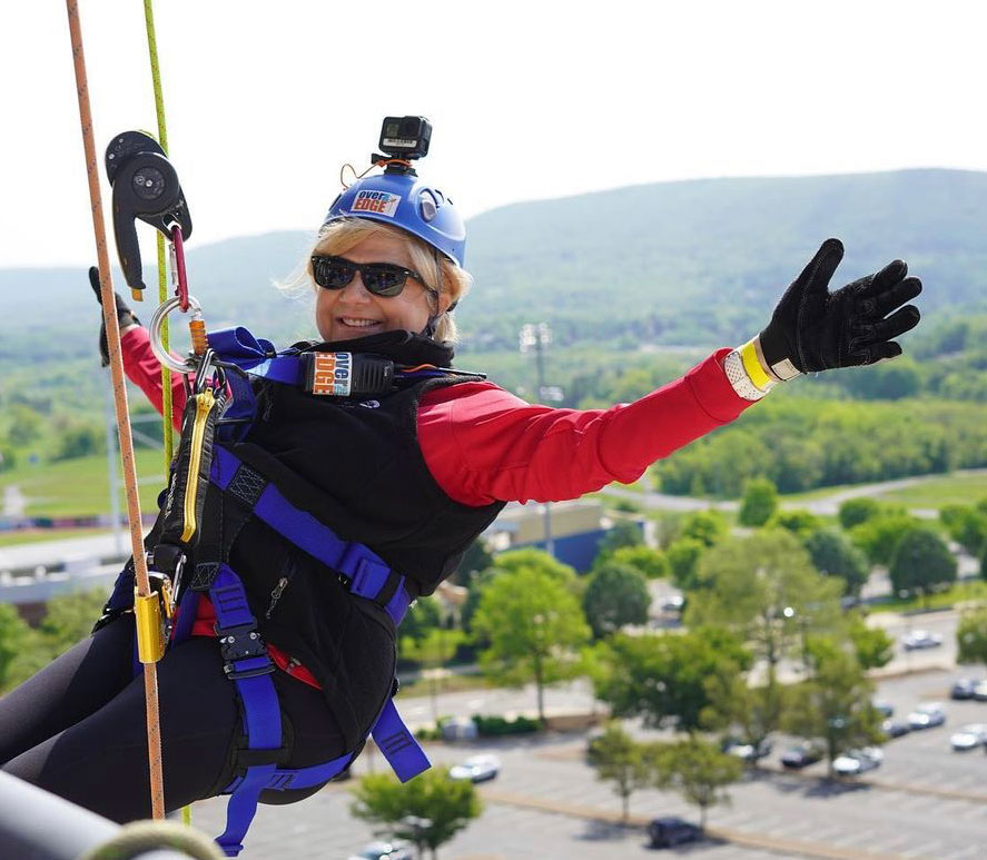 Paula Williams rapelling off Beaver Stadium, courtesy