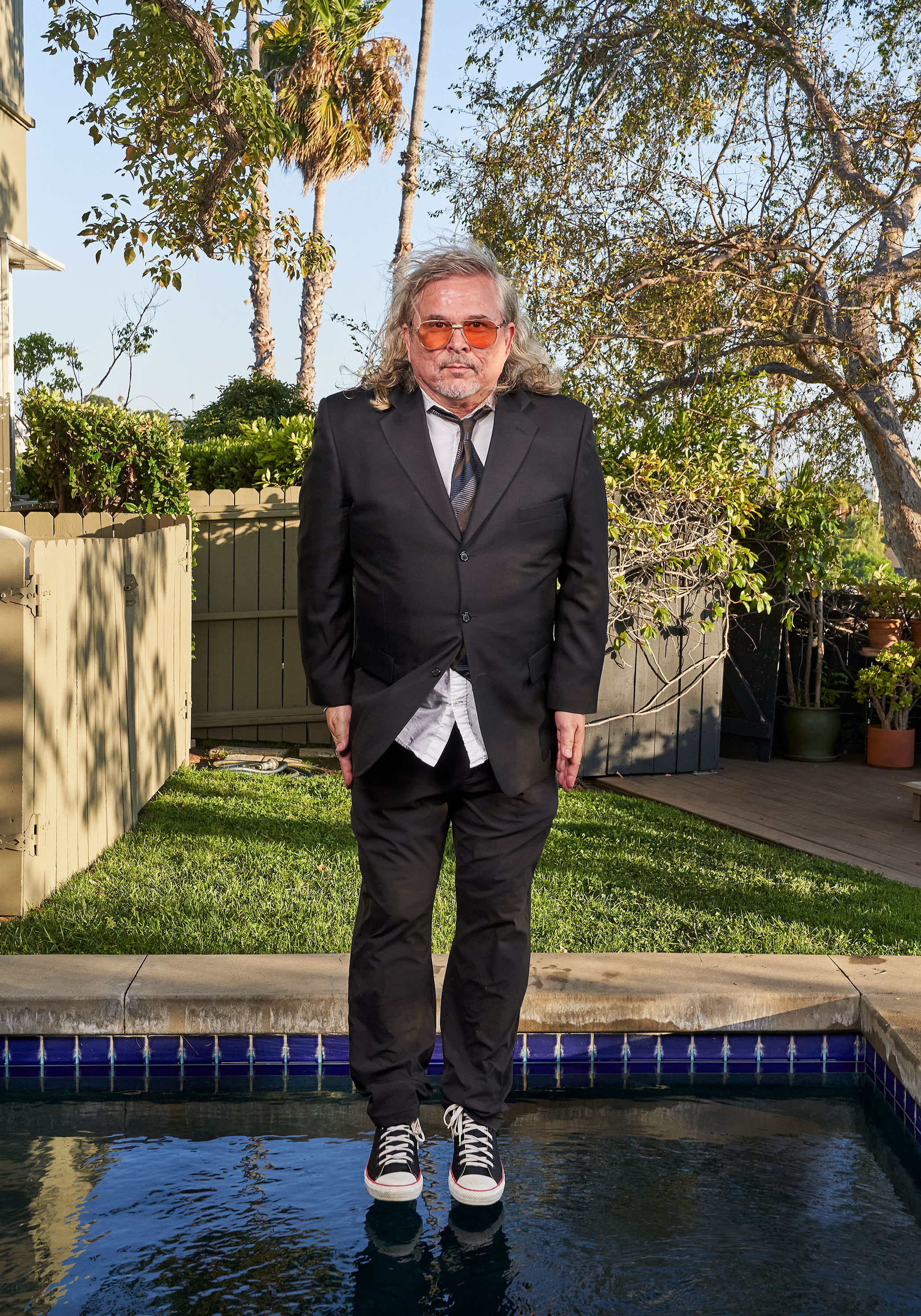 photo of Andrew Kevin Walker in mid-jump into his pool by Gregg Segal