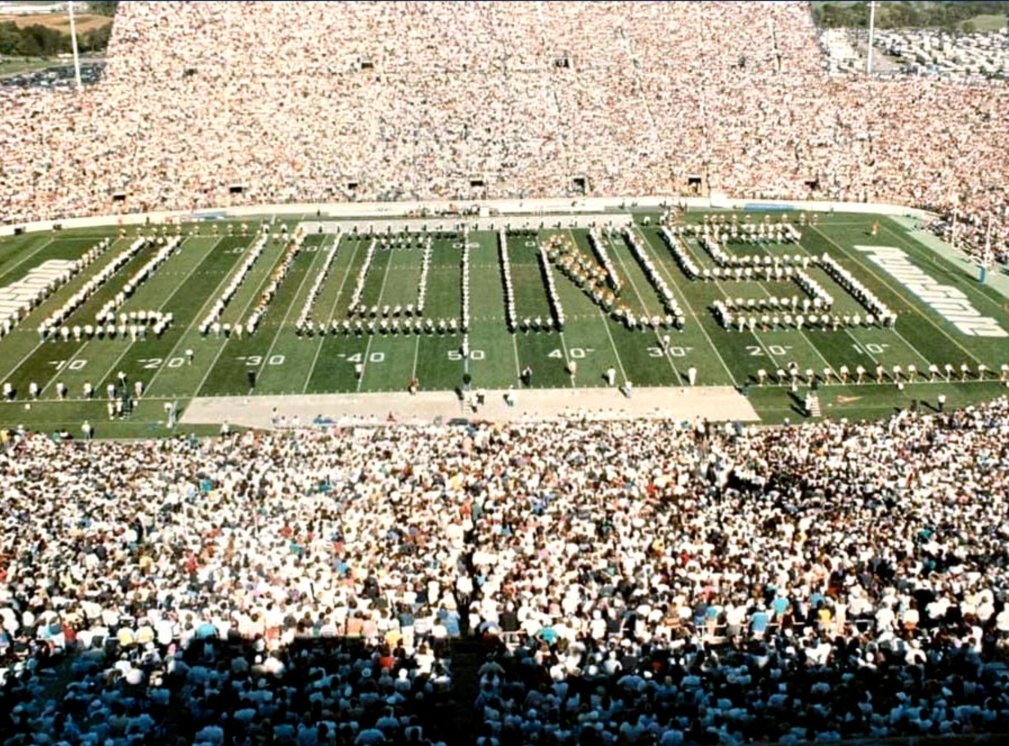 photo of Blue Band in Floating Lion formation spelling LIONS on the field, by Penn State Blue Band