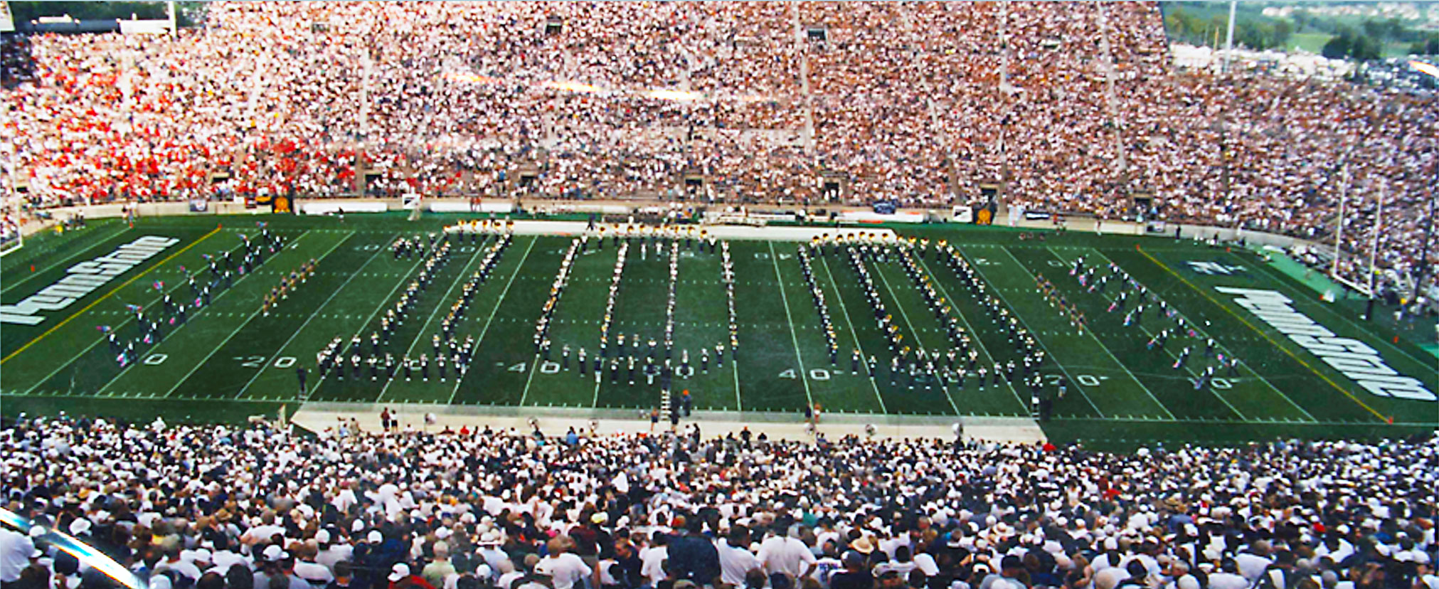 Photo of Blue Band spelling 100 on the field in 1999, by Penn State Blue Band