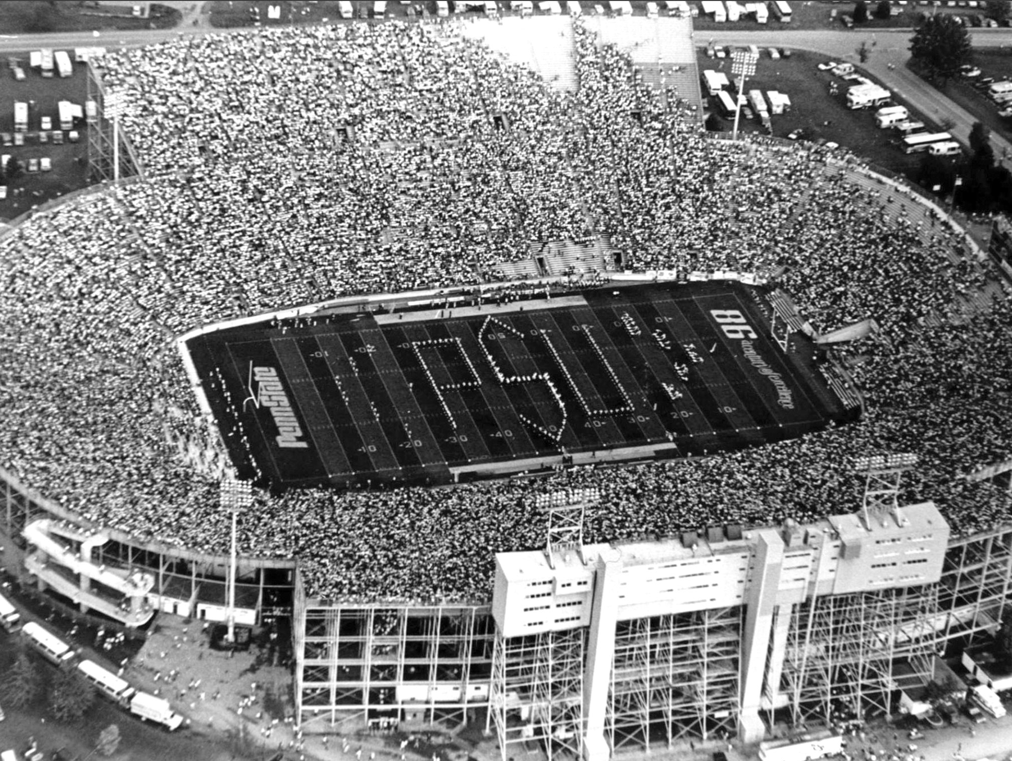 Black and white photo of Blue Band spelling PSU on the field by Penn State Blue Band