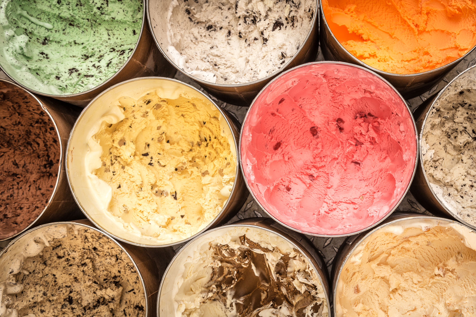 closeup of tubs of multicolored creamery ice cream by Nick Sloff '92 A&A