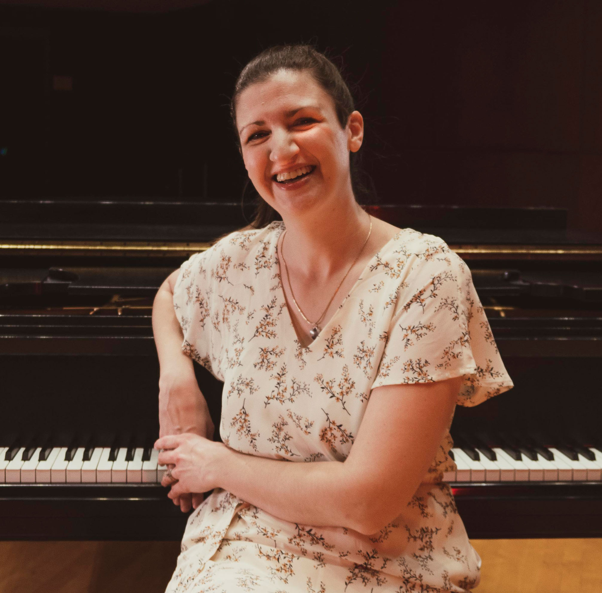 Amoriello in front of a piano, courtesy