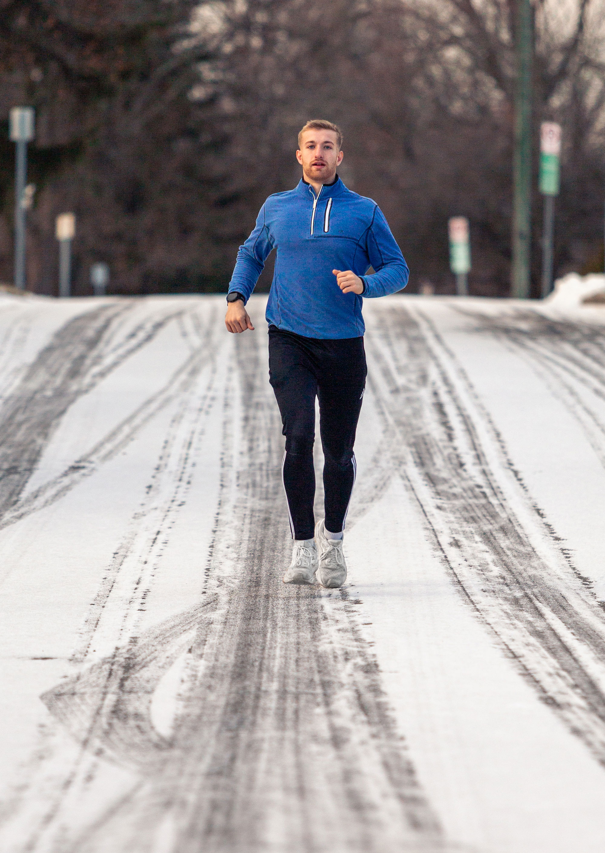 Hollingham running on a snowy road by Nick Sloff '92 A&A