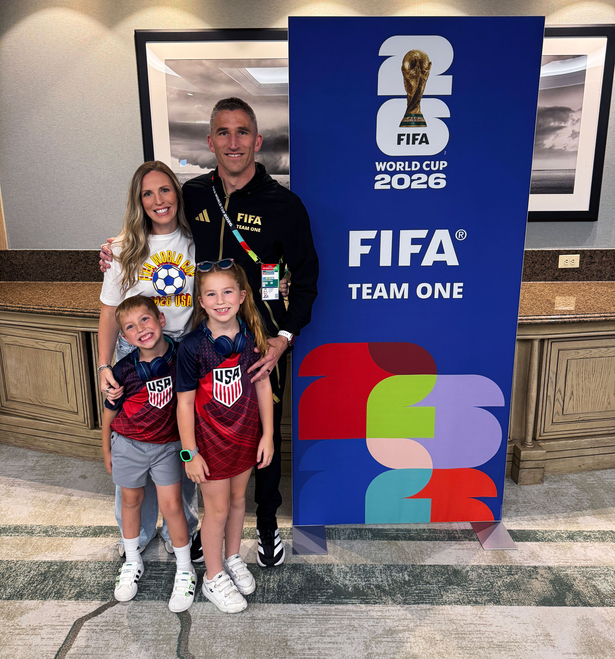 Parker family next to FIFA World Cup 2026 signage, courtesy