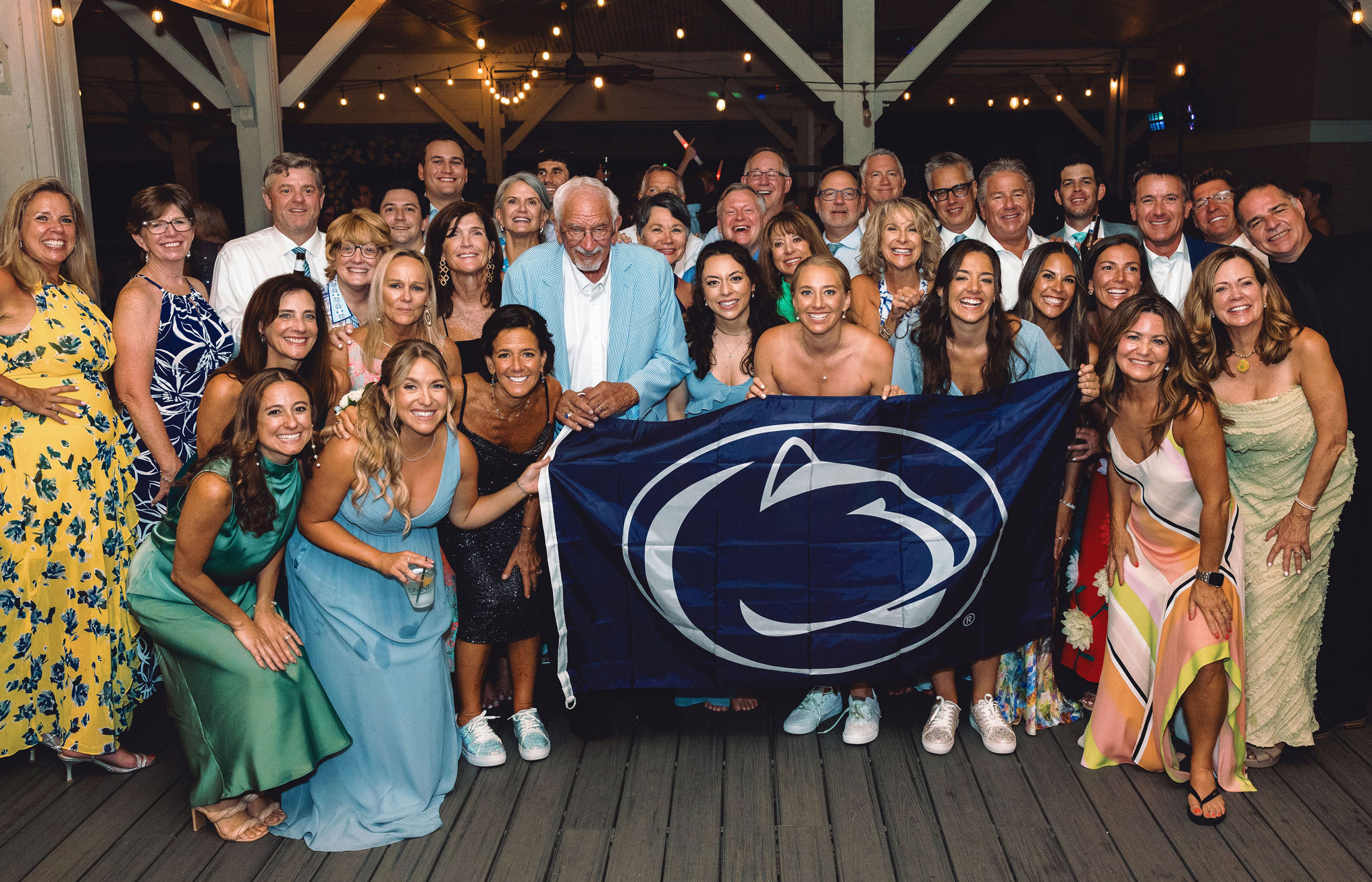 family photo with Lion flag during Turner wedding, courtesy