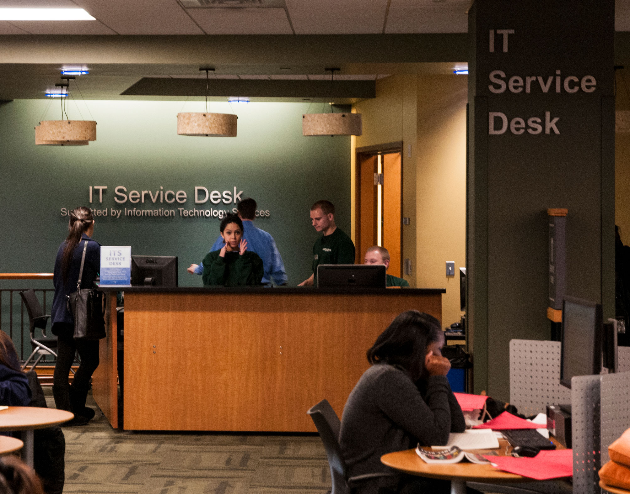 photo of IT Service Desk with employees and students by Penn State Libraries