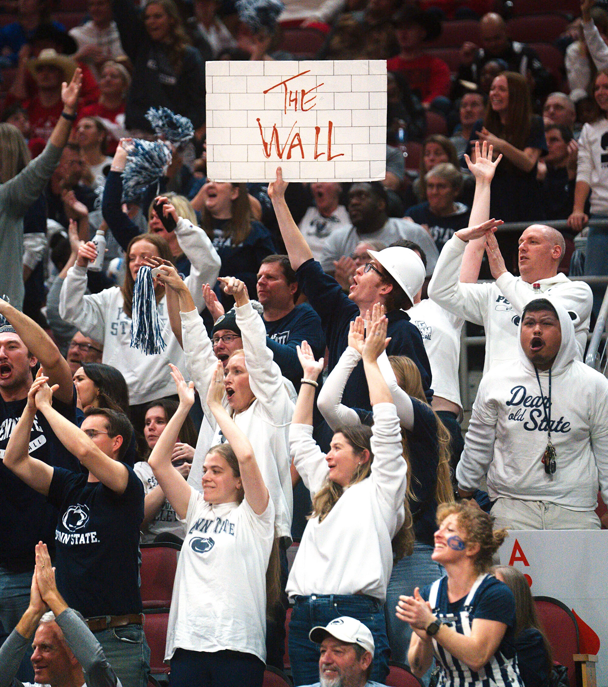 Nittany Lion women's volleyball fans hold up Pink Floyd's The Wall sign, photo by Penn State Athletics