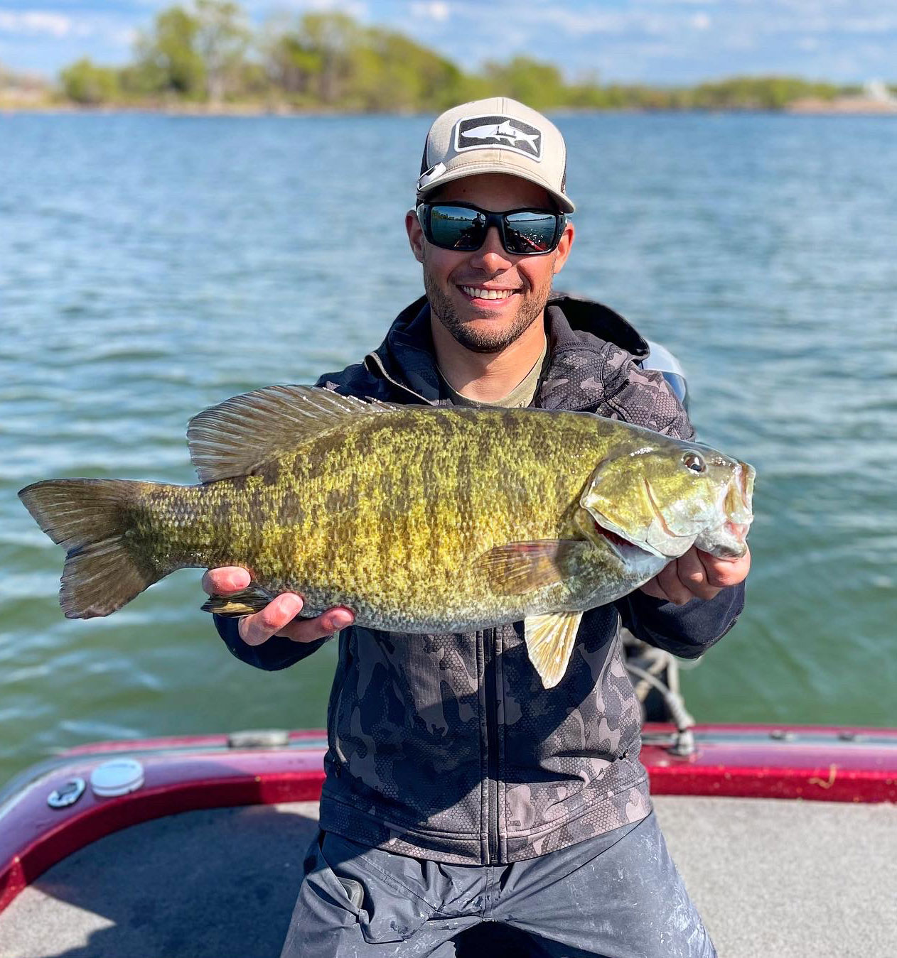 photo of Horner holding up a large bass, courtesy