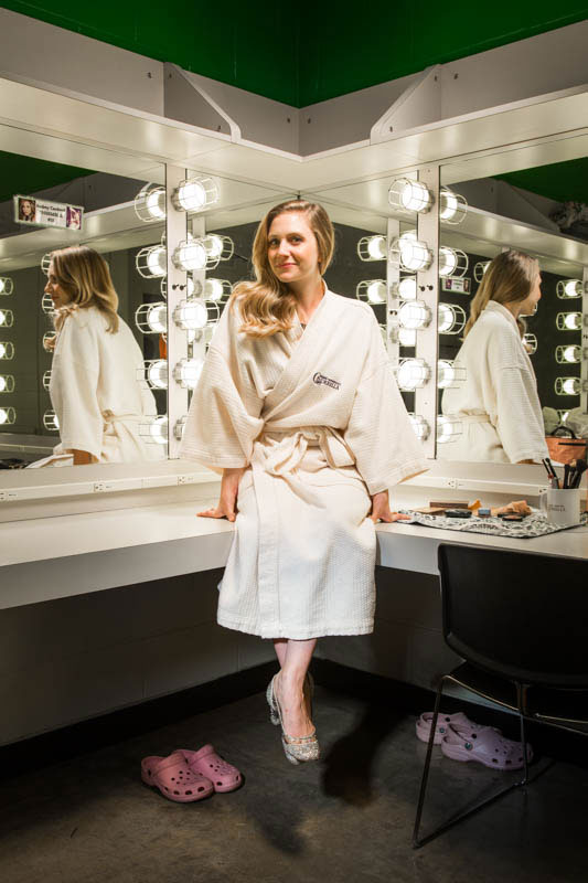 Audrey Cardwell in white robe in her backstage dressing room, photo by Ryan Donnell