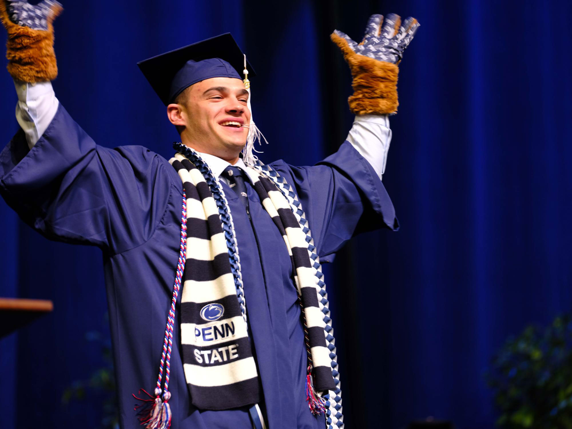 Reber in gap and gown, photo by Penn State