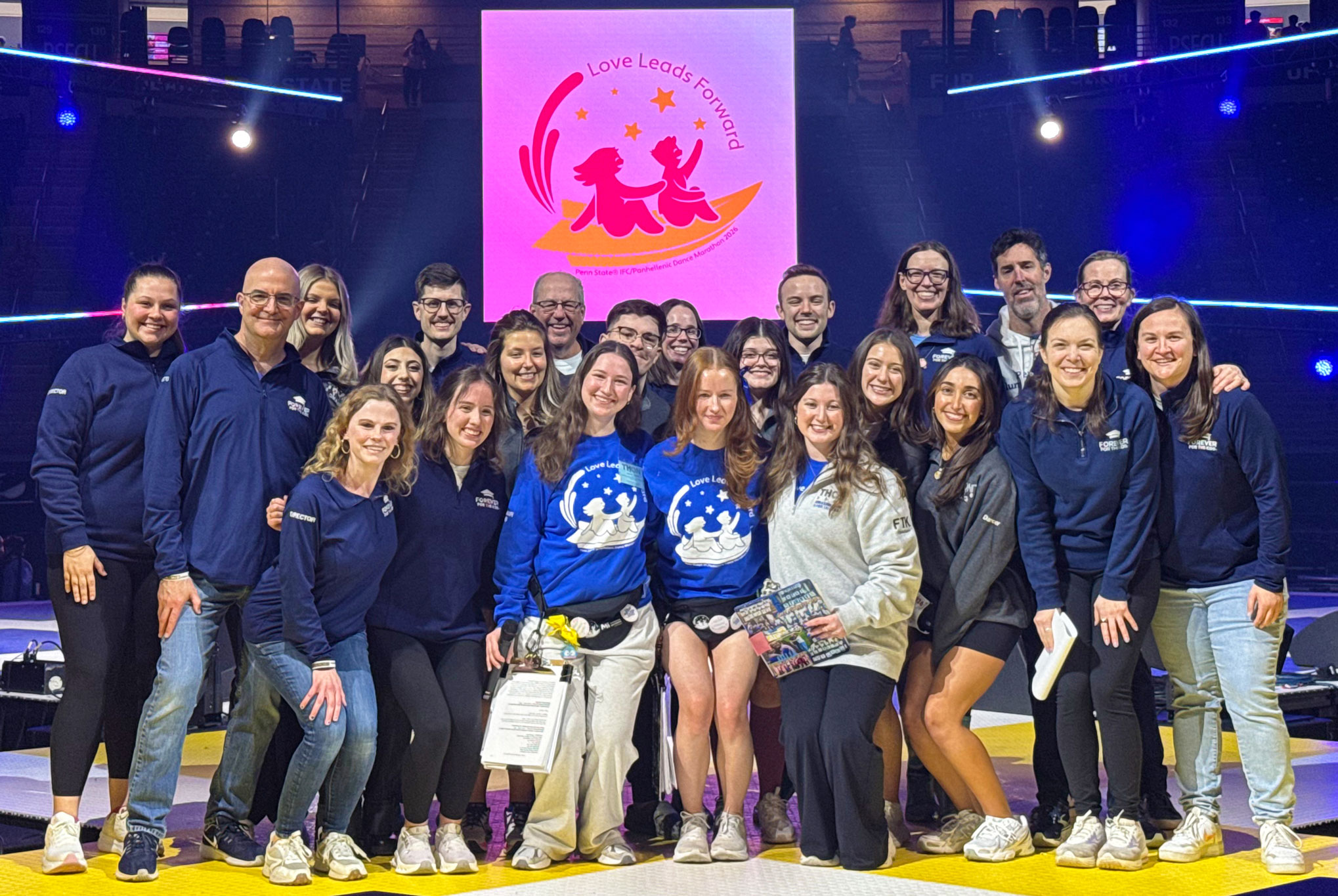 THON alumni dancers and AIG members group photo after THON total announced, by Penn State Alumni Association