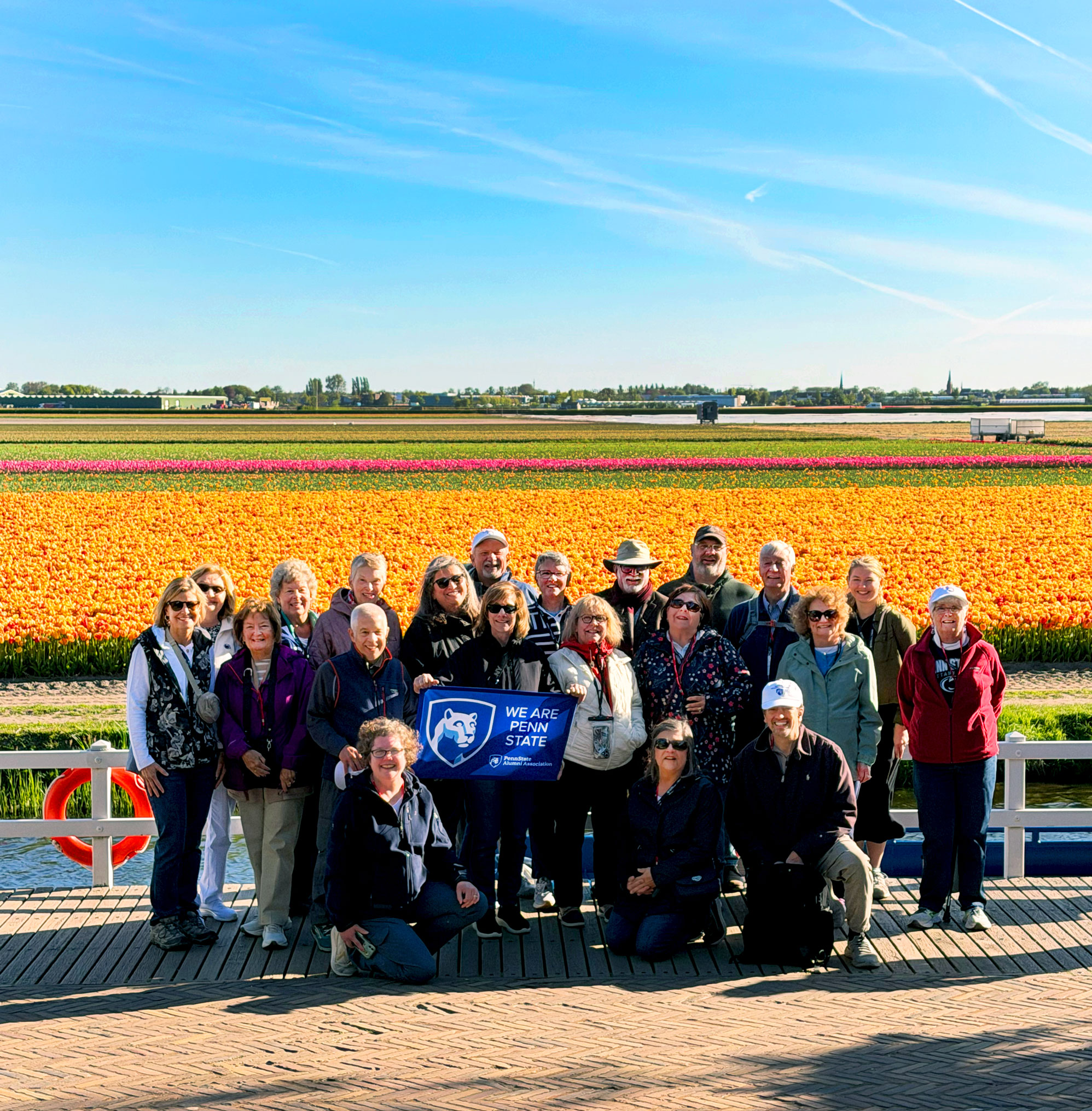 alumni and families at tulip fields on Dutch Waterways cruise in April, PSAA