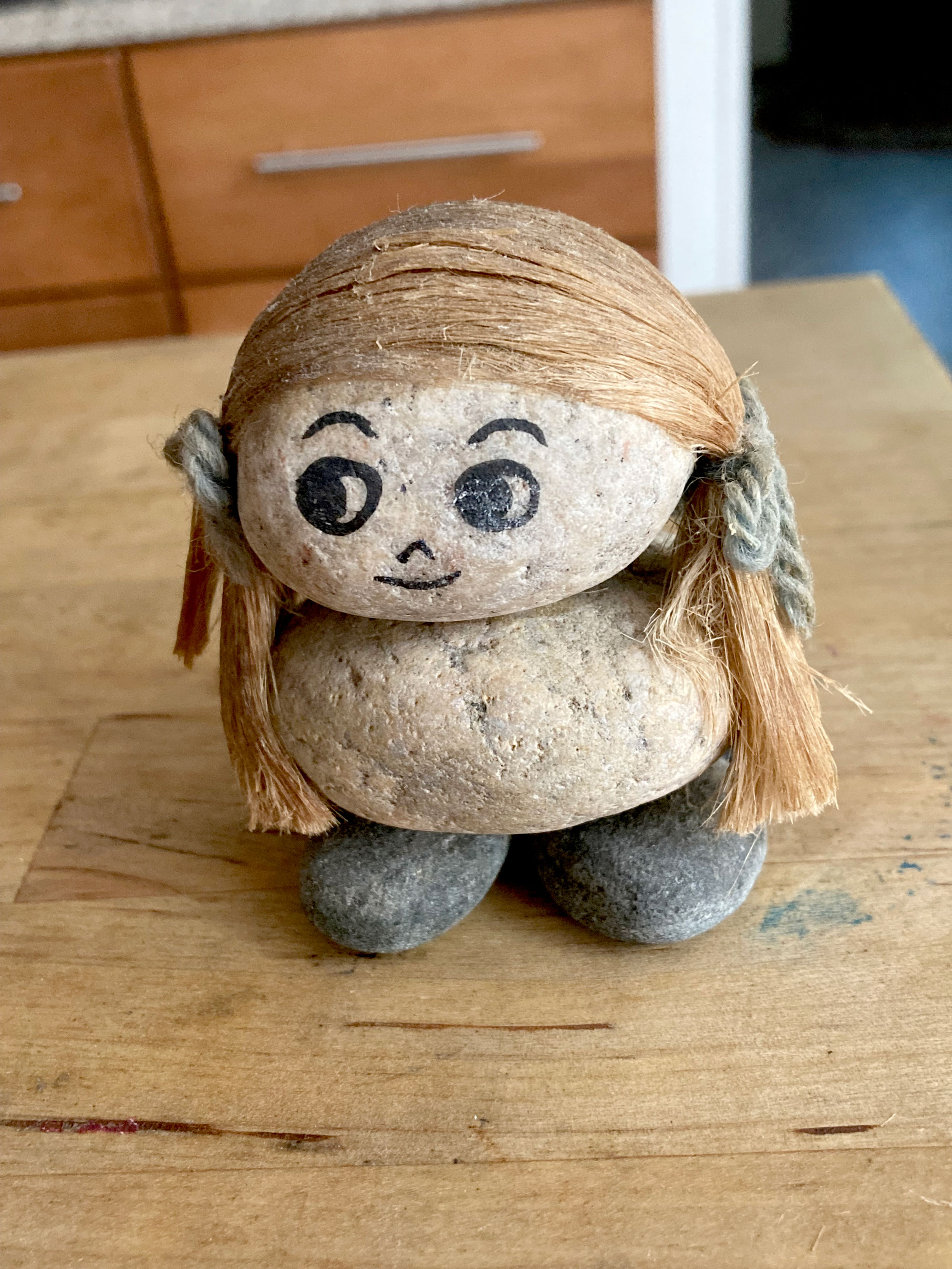photo of a small rock doll an alum purchased at the Ethel Meserve store