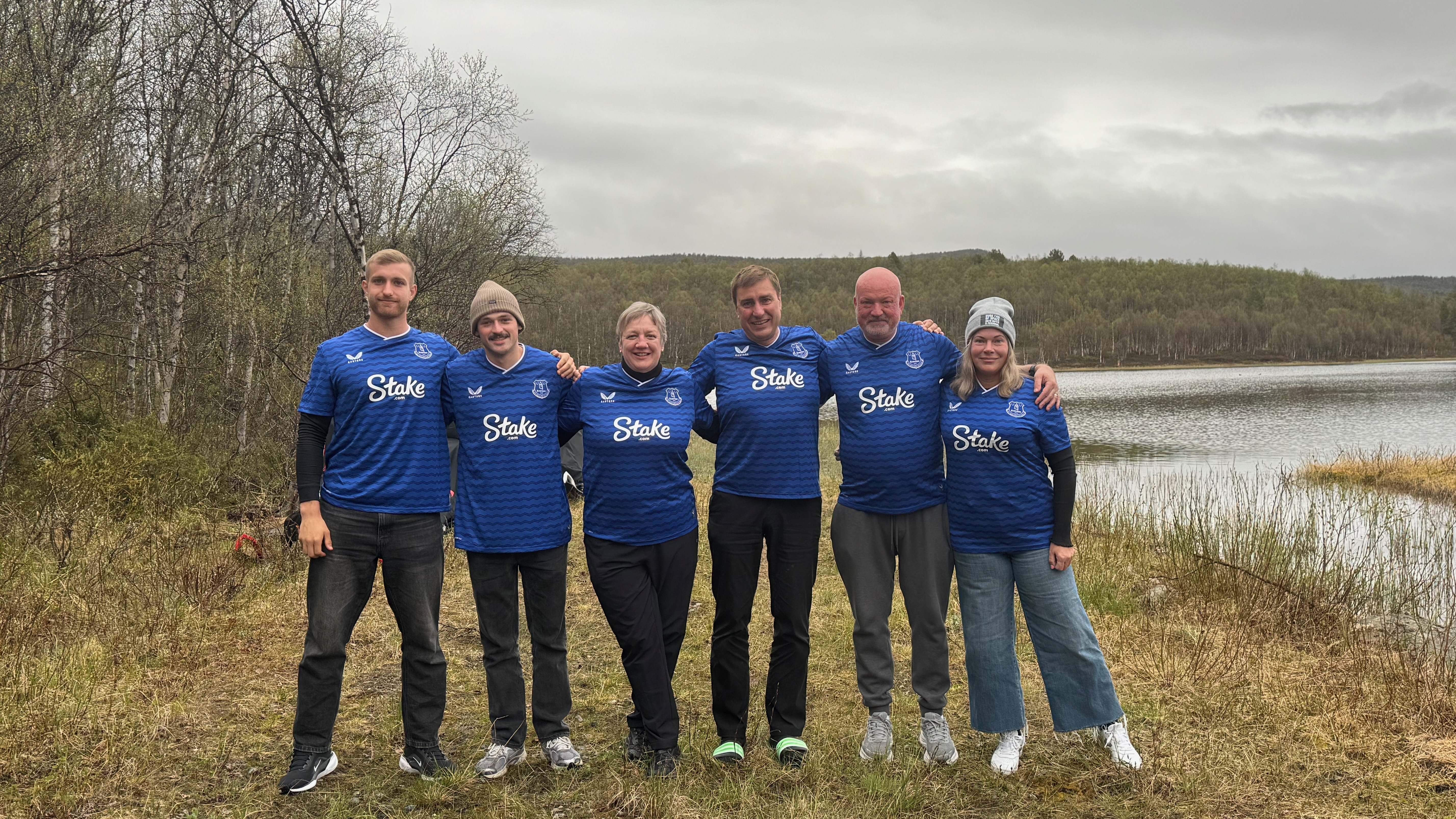 Hollingham with his parents and Lovisa's parents wearing custom Everton Football Club jerseys, courtesy