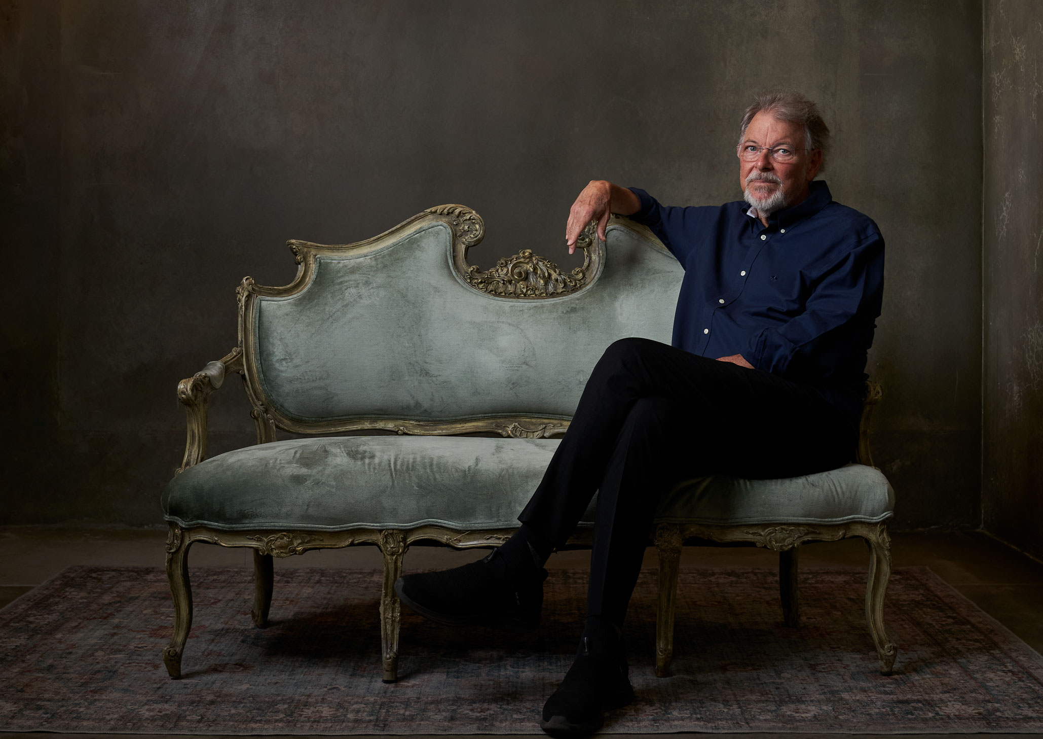 Frakes on an antique settee, photo by Gregg Segal
