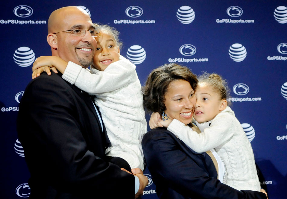 James Franklin and wife both holding small children, photo by Centre Daily Times / Abby Drey