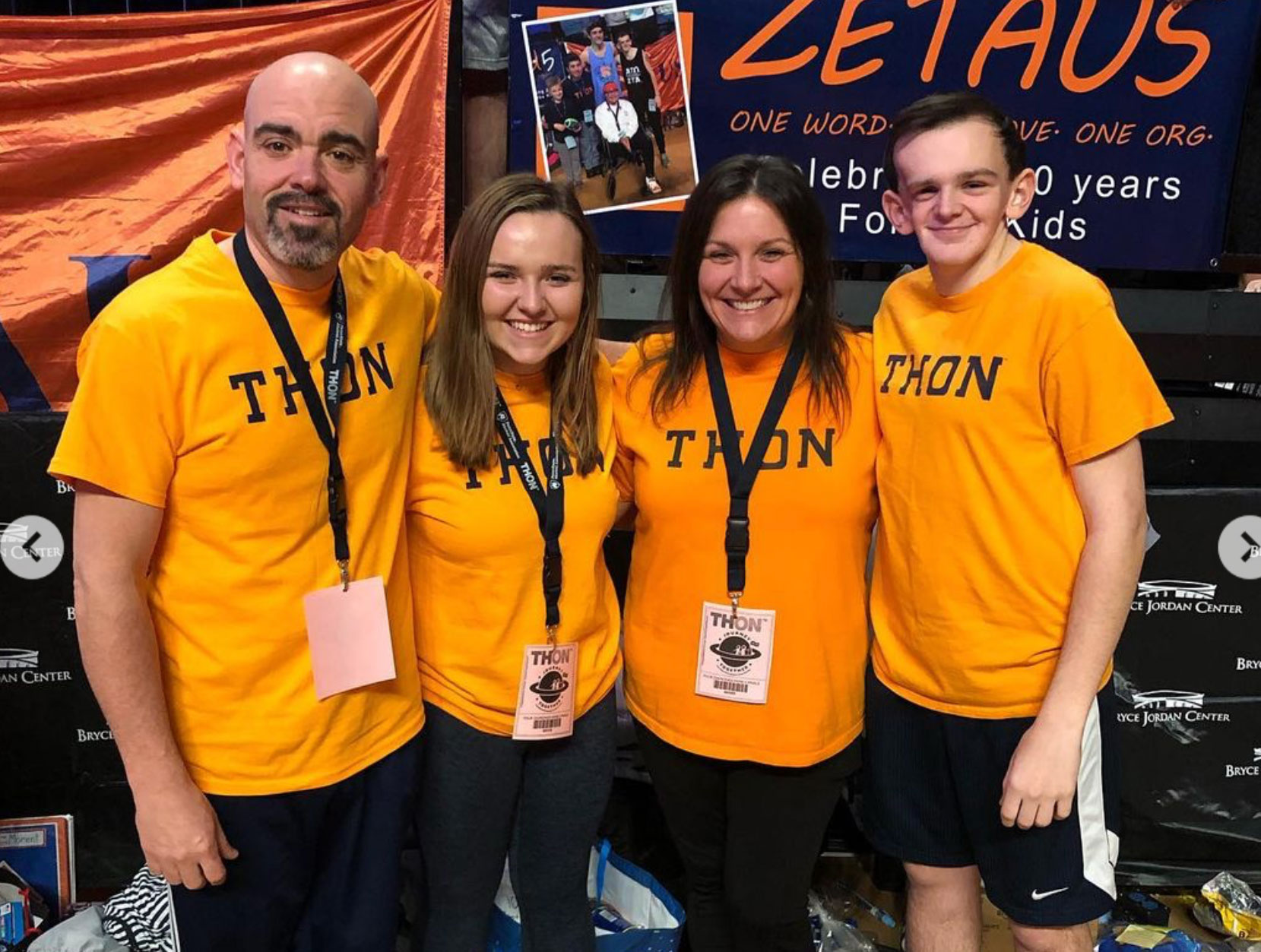 Haas family in matching orange THON shirts, courtesy