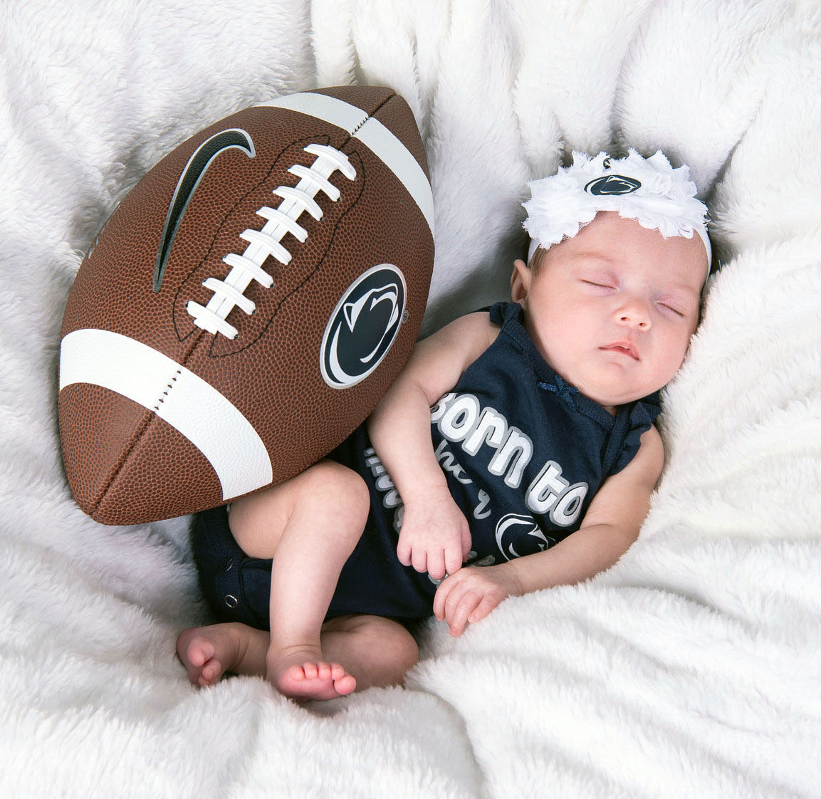 Heimbach baby with football, courtesy