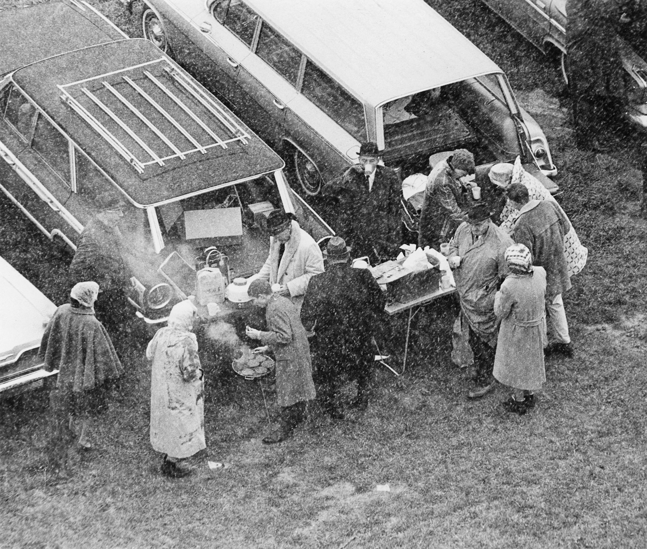 black and white photo of tailgaters on a snowy day by Penn State Alumni Association