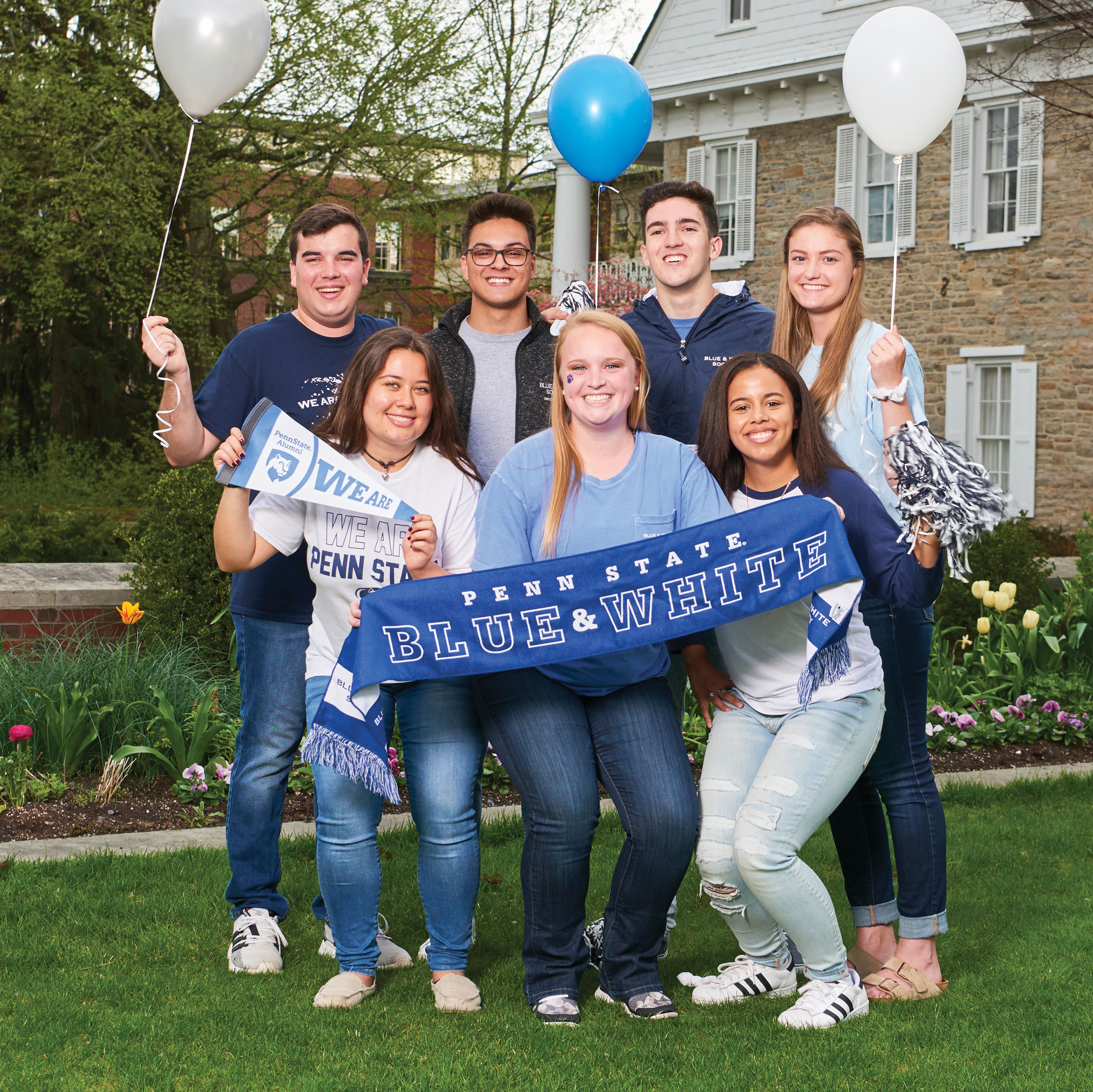 Blue and White Society students with blue and white balloons on the Hintz lawn, photo by PSAA