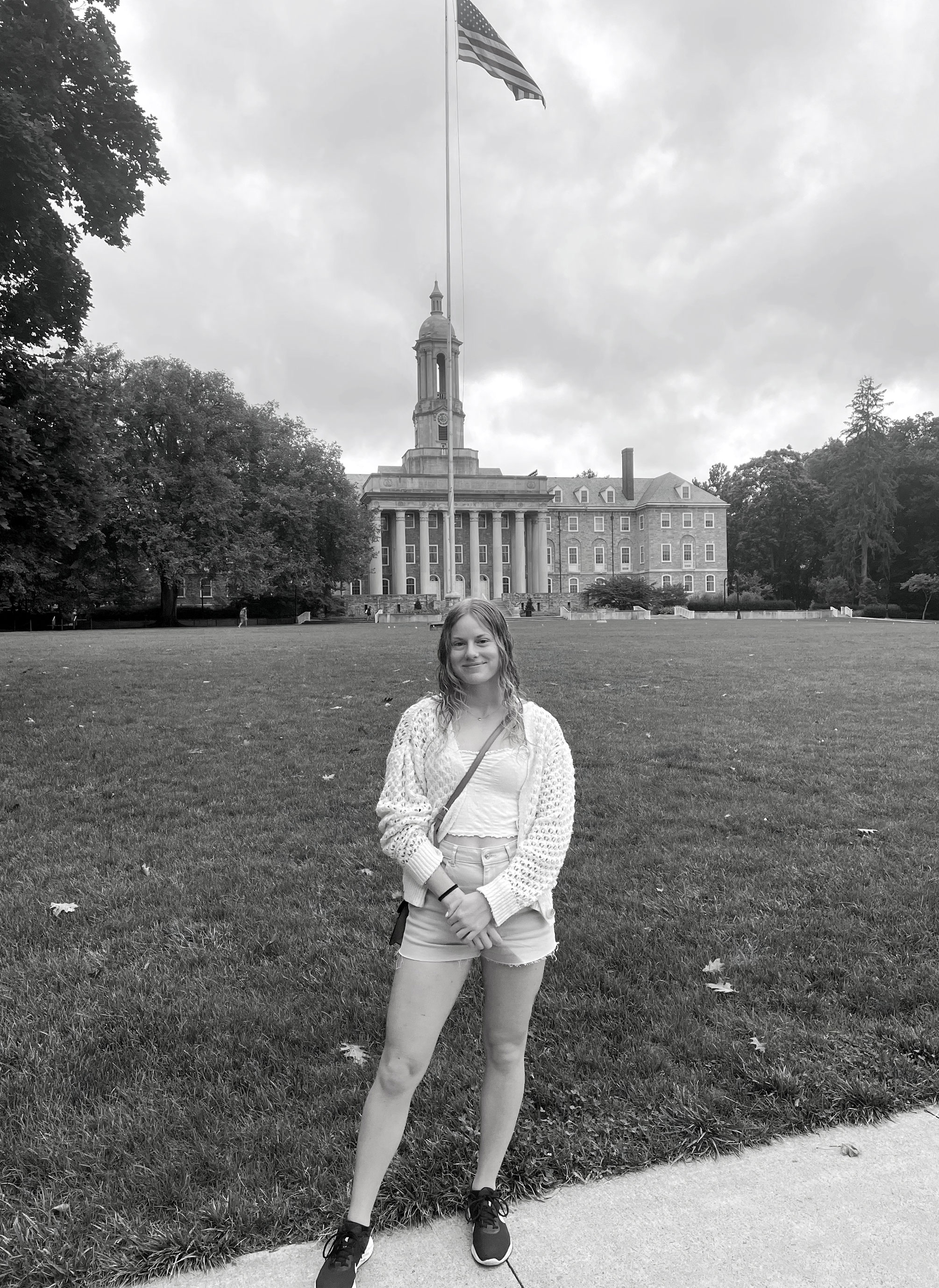 black and white photo of  Lovisa Arnesson-Cronhamre in front of Old Main, courtesy