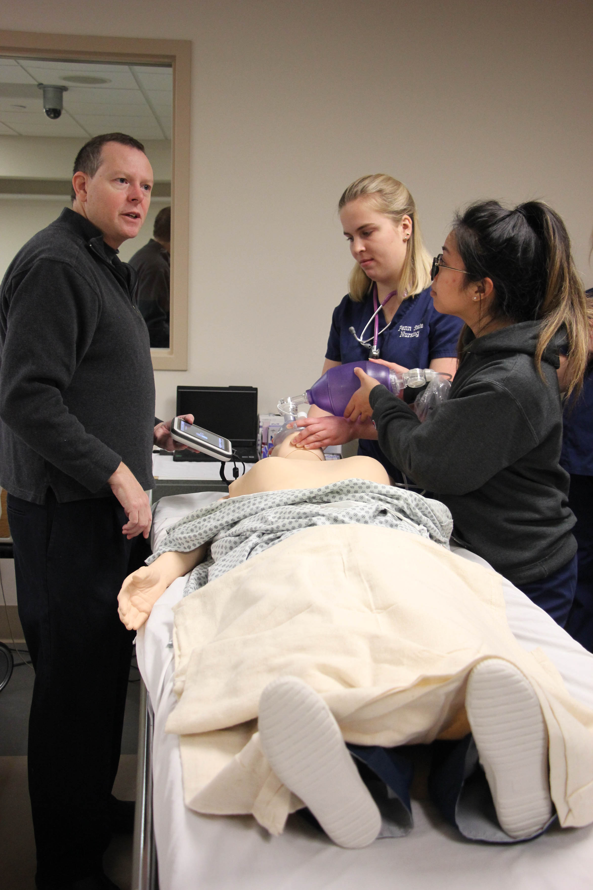 photo of nursing students working on a dummy patient, courtesy