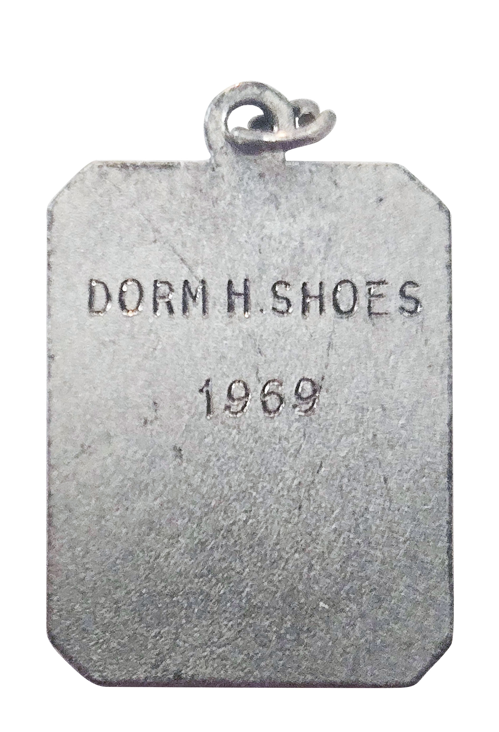 closeup of back of medal, courtesy