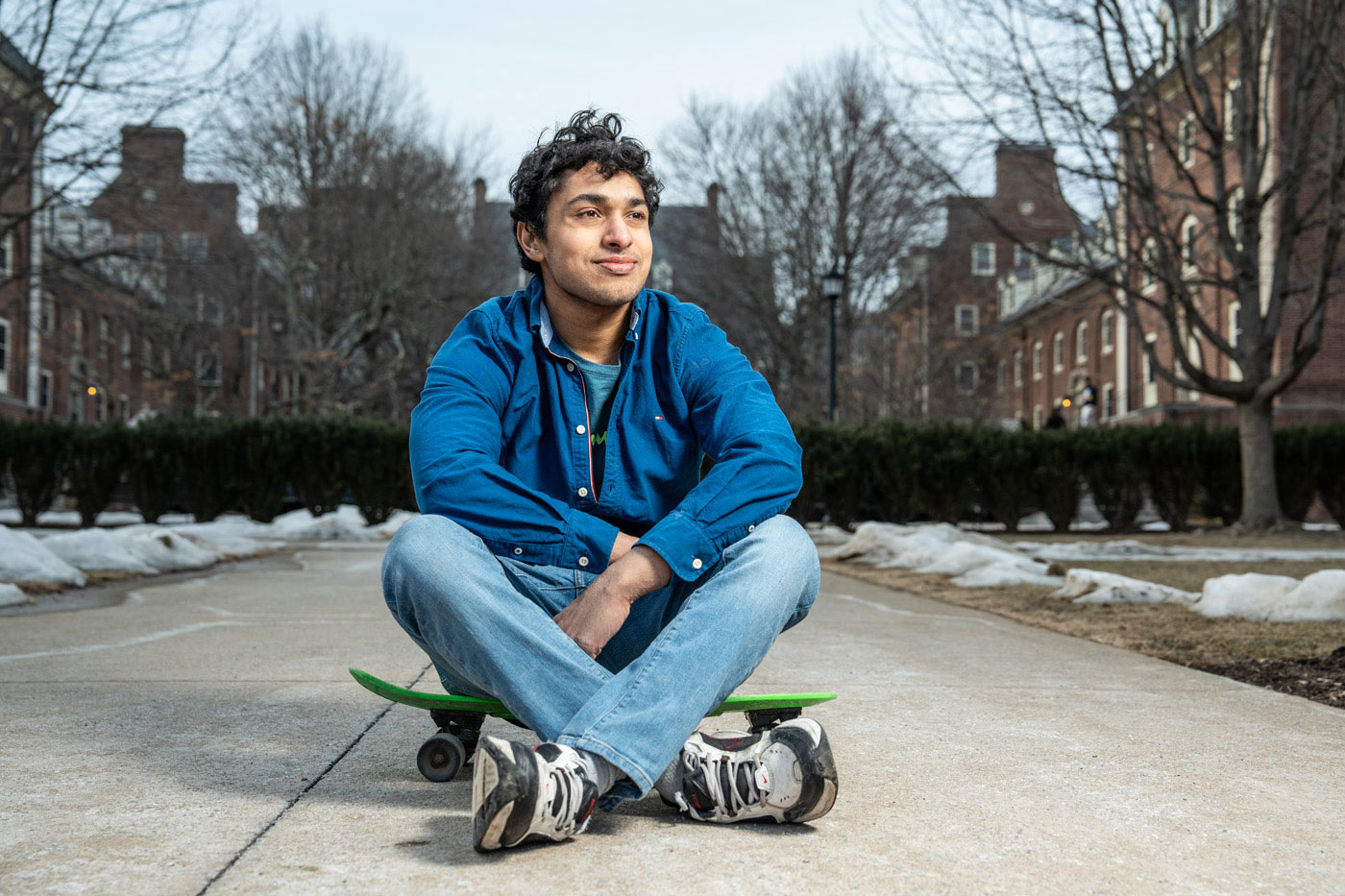 Kadavil seated on sidewalk, photo by Cardoni