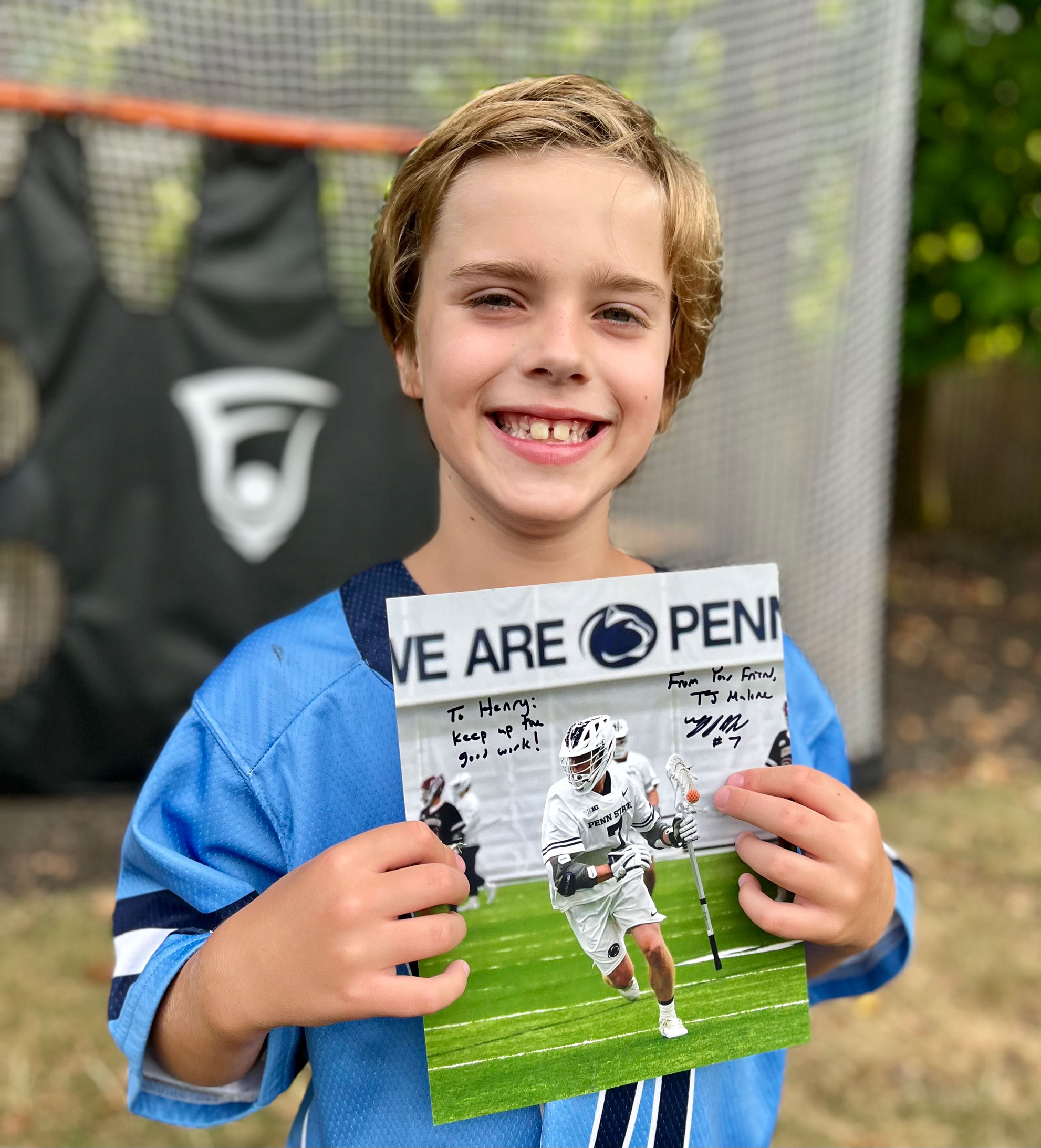 Henry holding up TJ Malone story from July/Aug '24 issue, courtesy