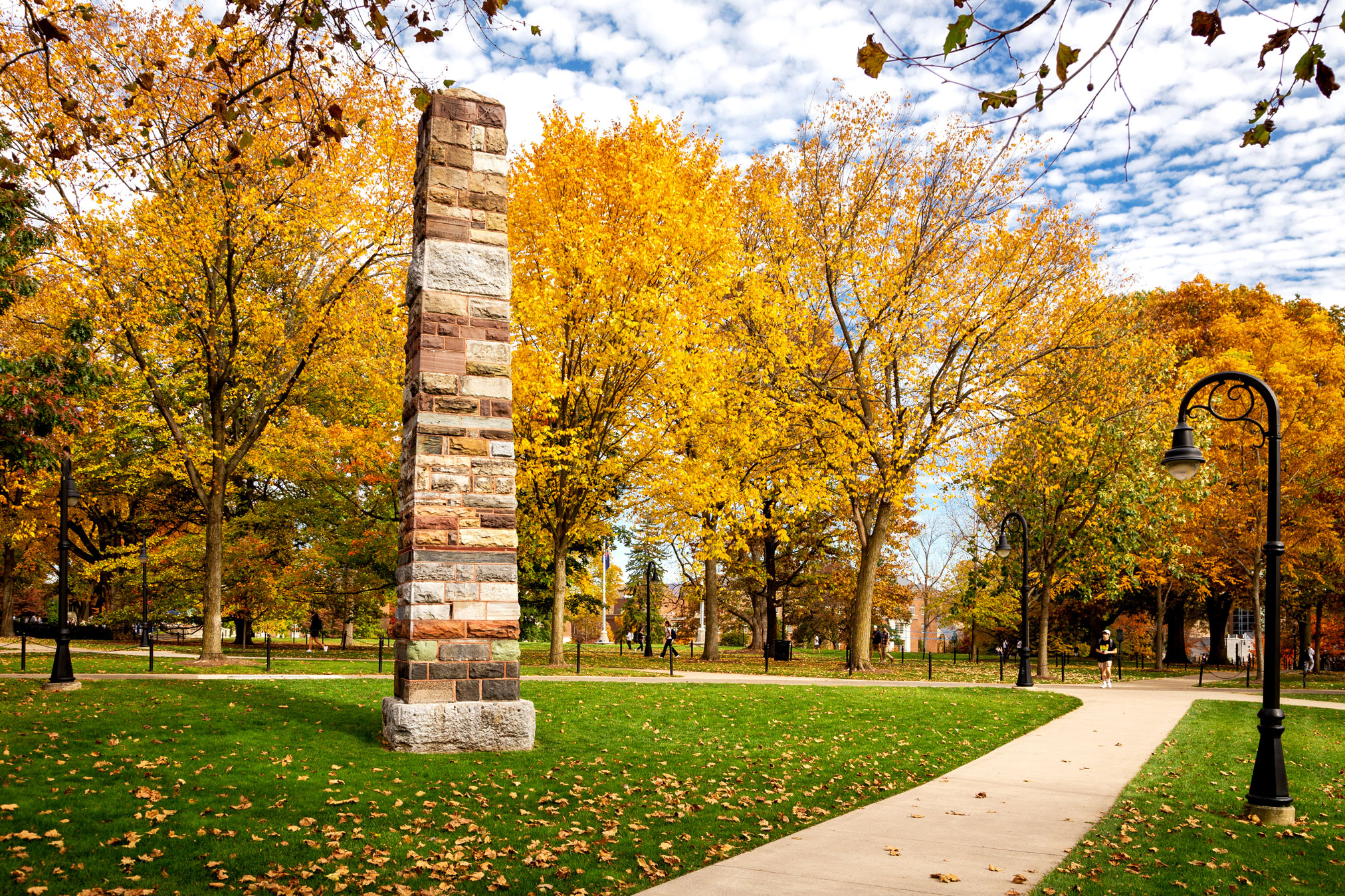obelisk at University Park amid yellow fall leaves, photo by Nick Sloff '92 A&A