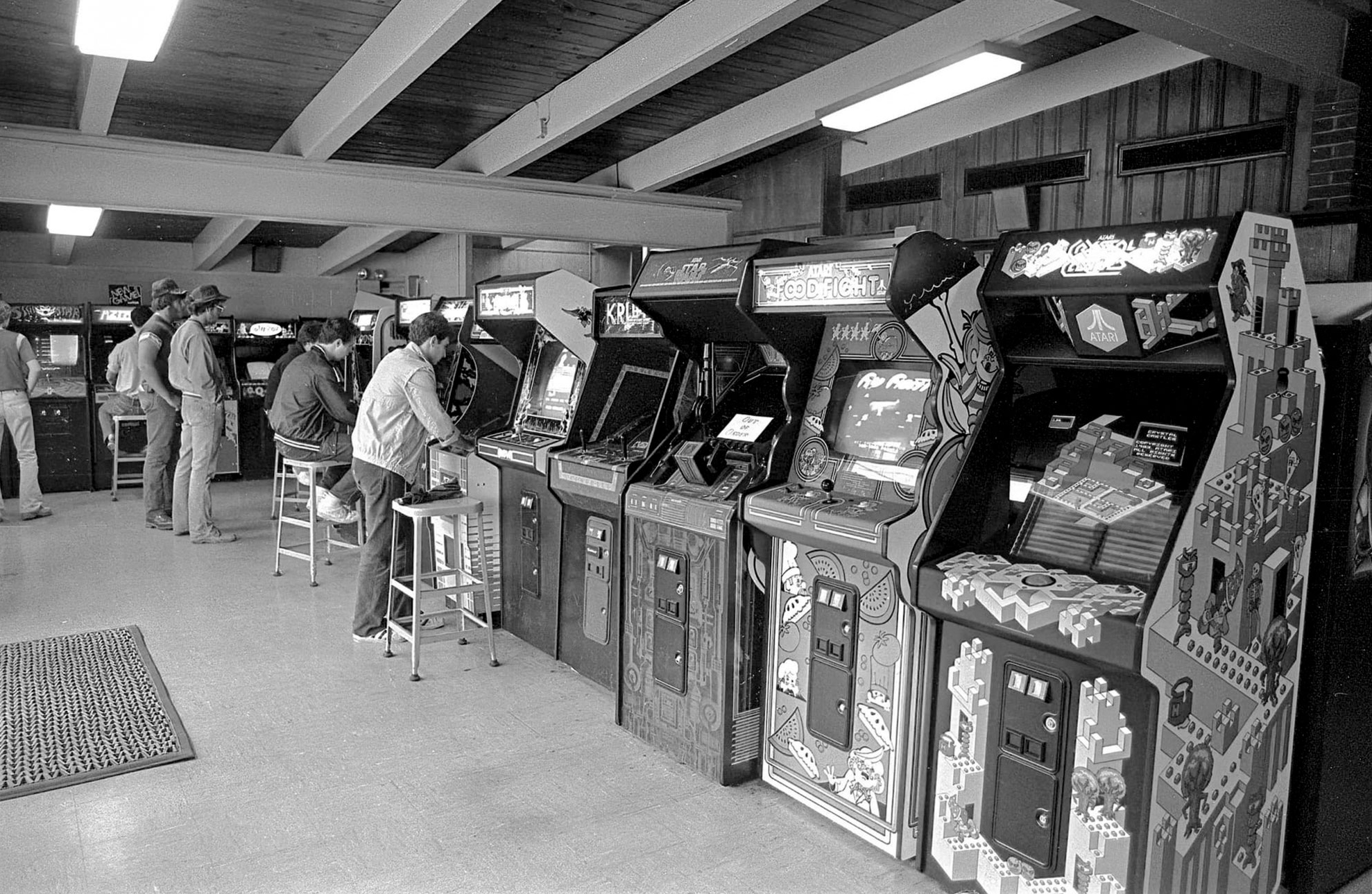 black and white photo of a row of arcade games at Playland by Pat Little