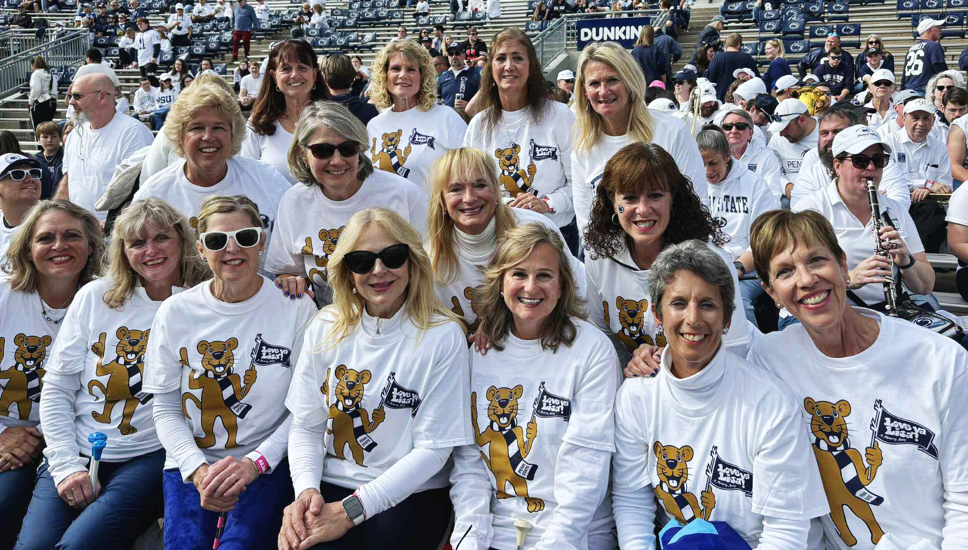 group photo of women wearing white Nittany Lion shirts, courtesy
