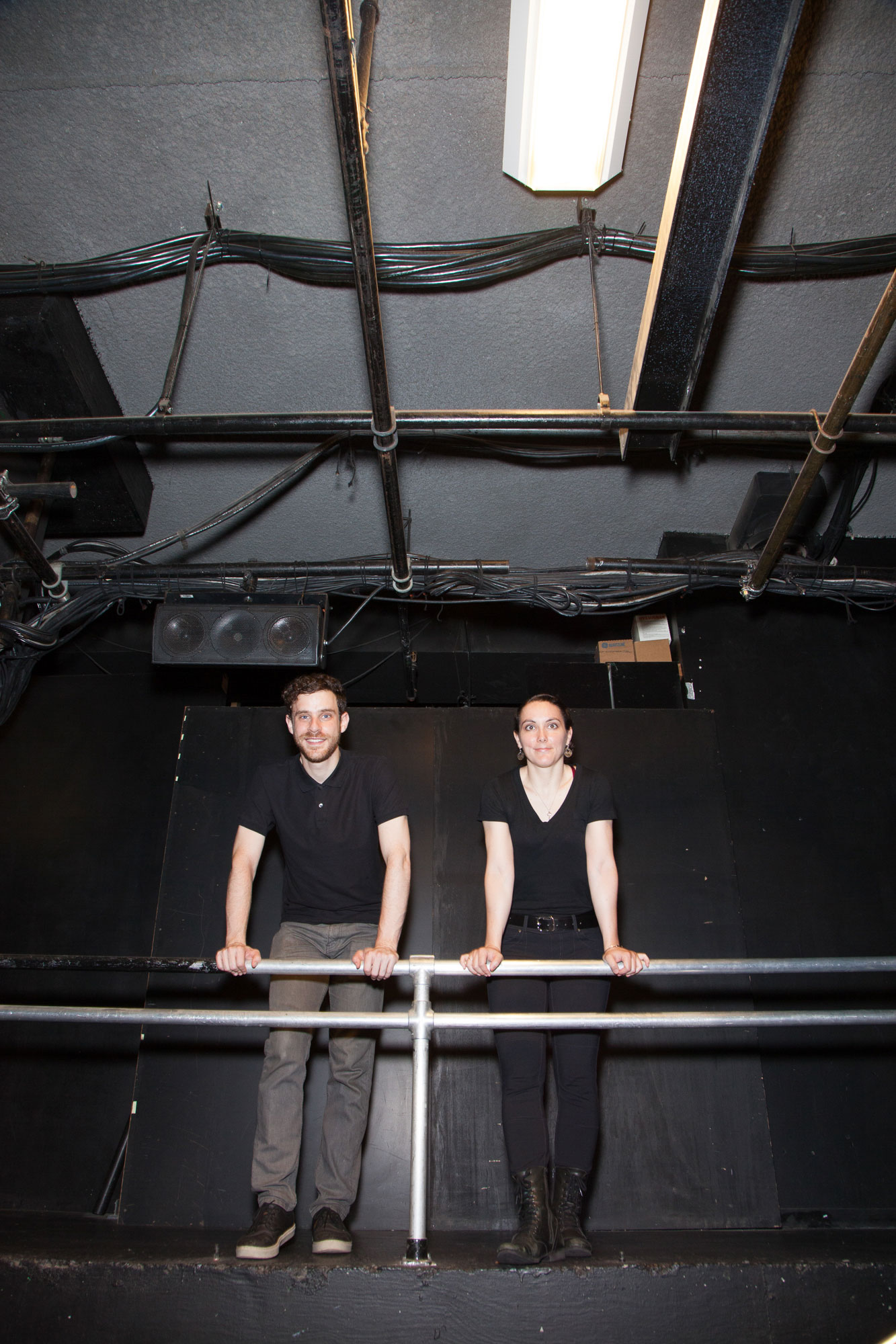 Tim Love and Kelly Ice leaning against scaffolding backstage, photo by Michael Lavine