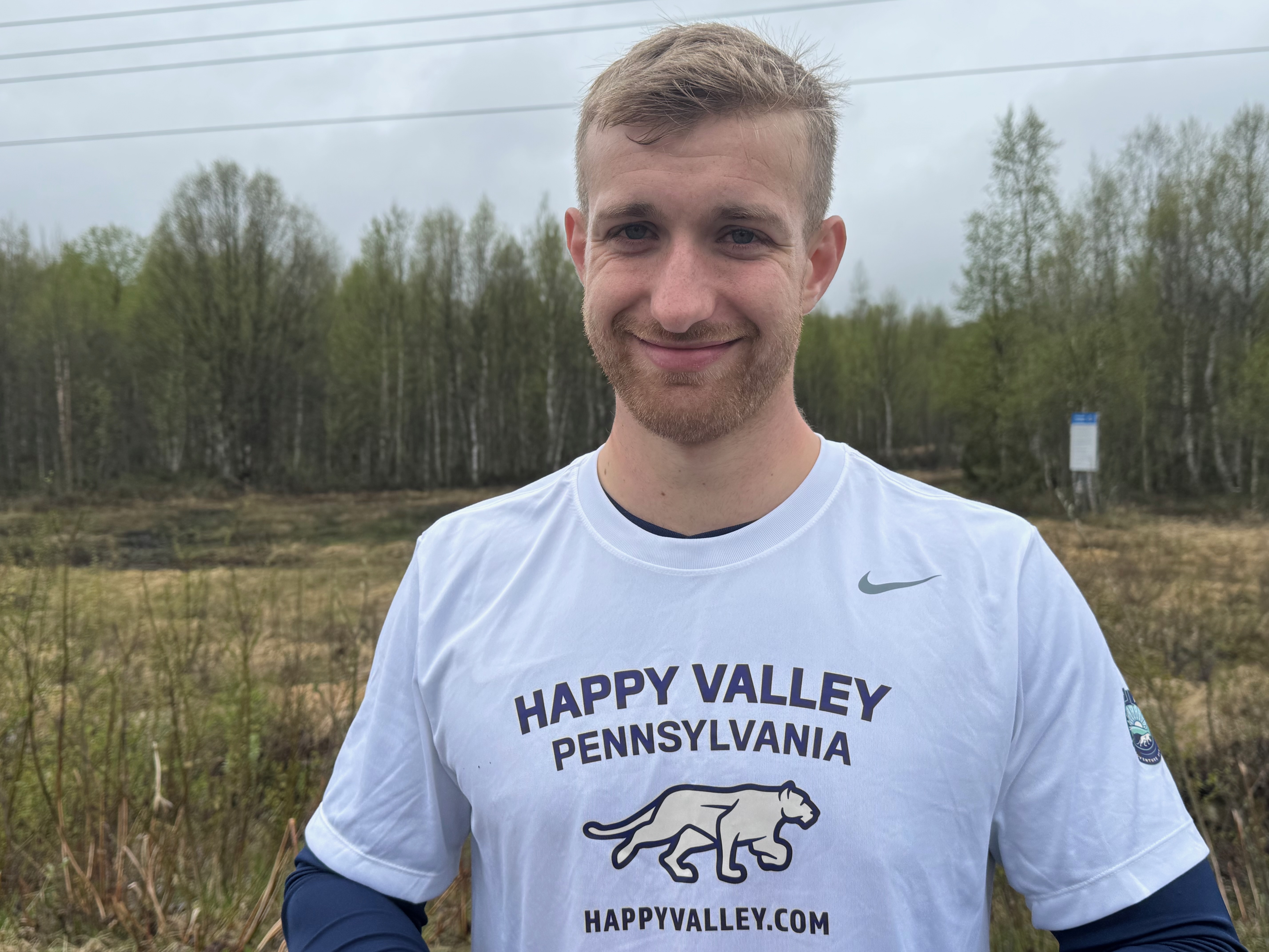 Hollingham wearing a Happy Valley t-shirt, courtesy
