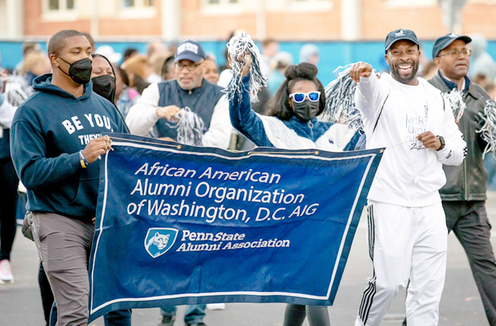 group photo of African American Alumni Organization of Washington D.C. holding their banner, courtesy