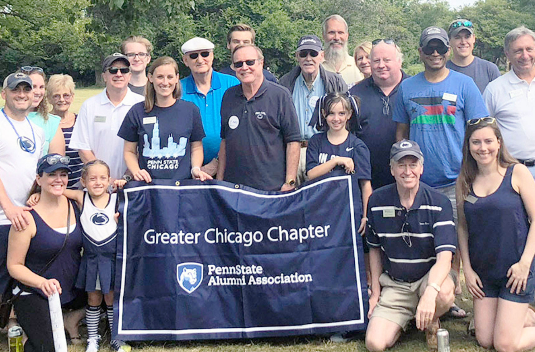 group photo of Greater Chicago Chapter, with their banner, courtesy
