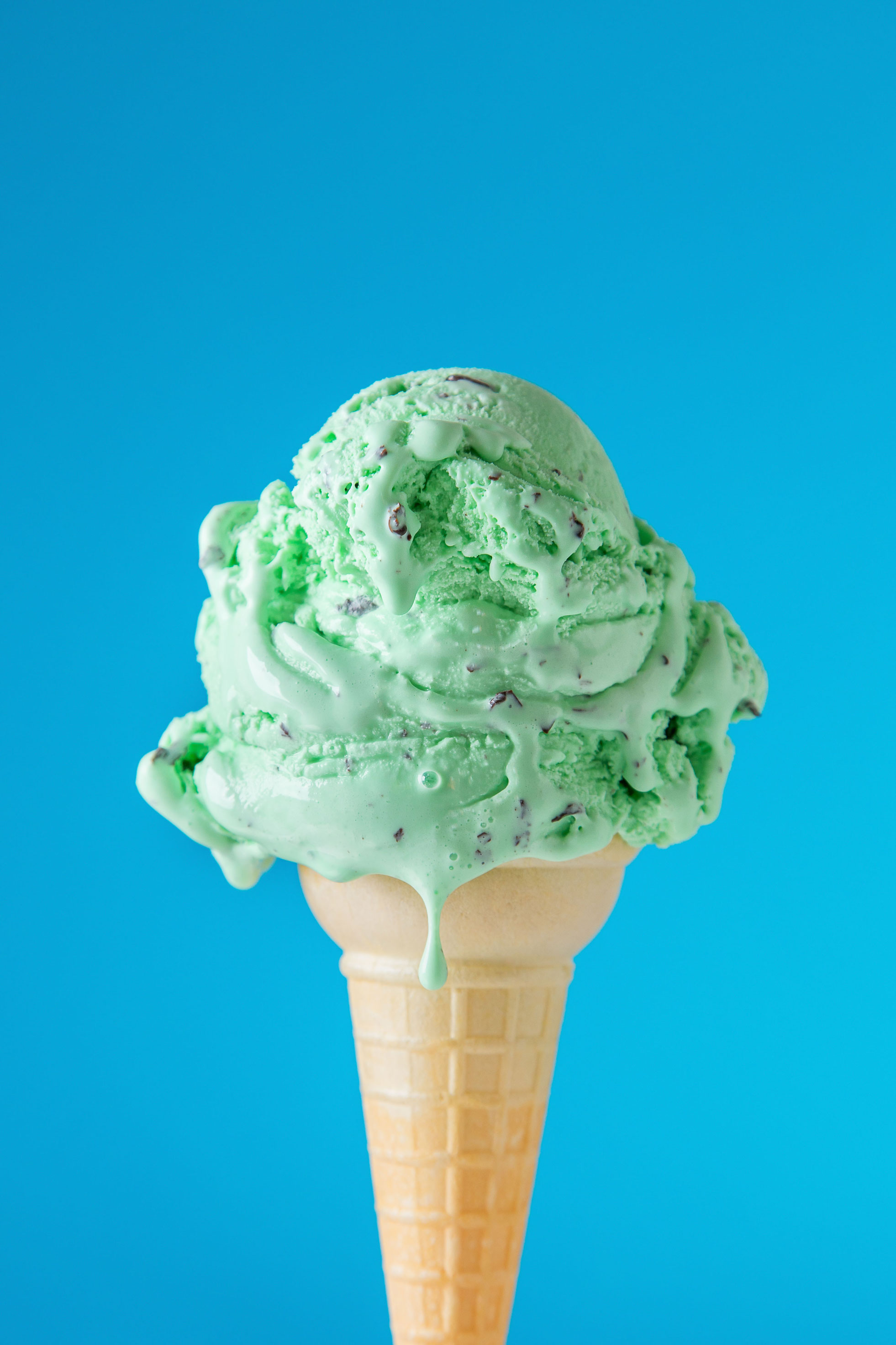 mint choc chip cone on blue background, photo by Nick Sloff '92 A&A