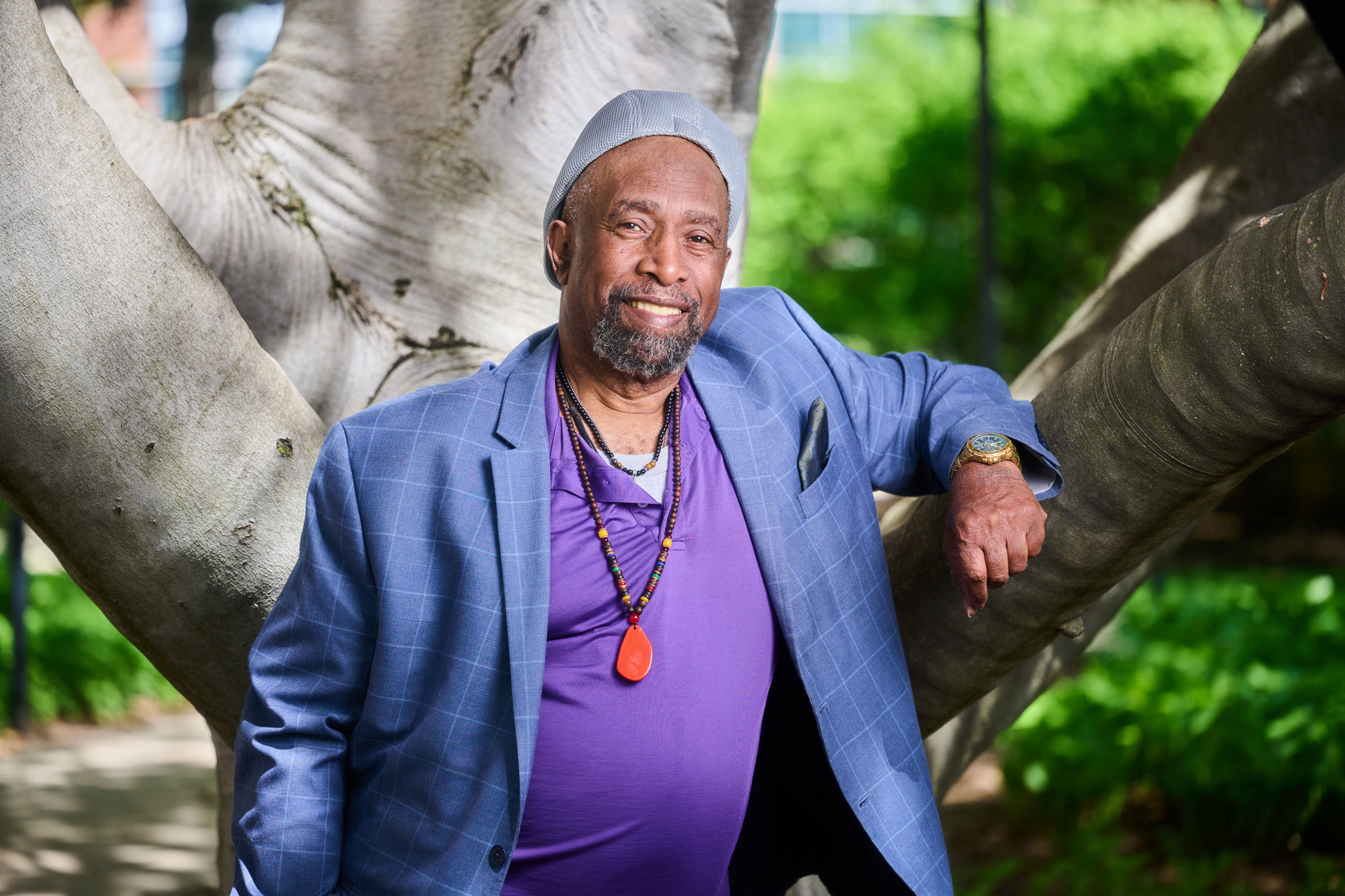 Irvin Moore standing outside against a tree, photo by Steve Tressler